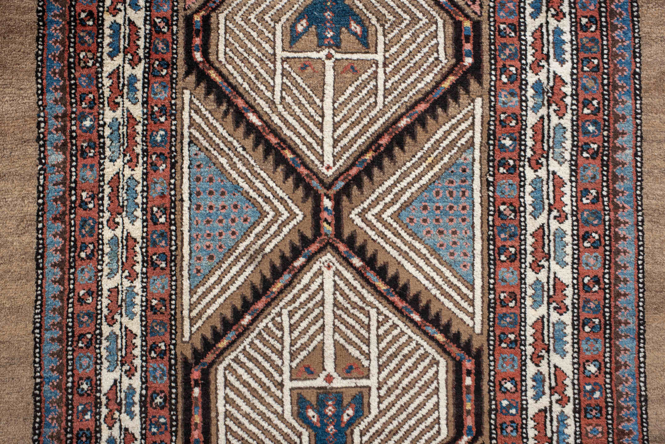 3' x 16' one-of-a-kind handmade antique Sarab runner rug. Color palette: ivory, rust, red, indigo, camel, navy, brown