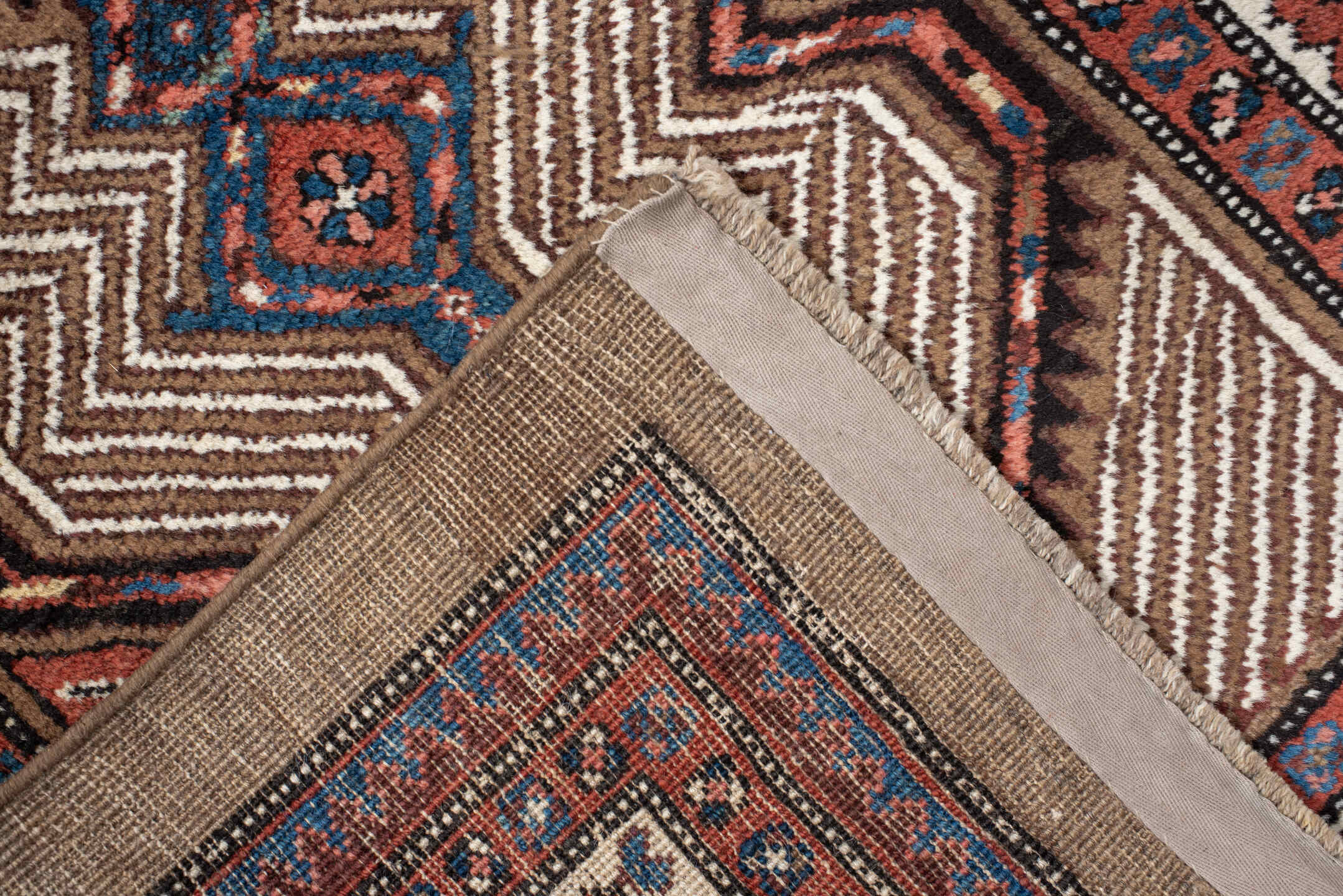 3' x 16' one-of-a-kind handmade antique Sarab runner rug. Color palette: ivory, rust, red, indigo, camel, navy, brown