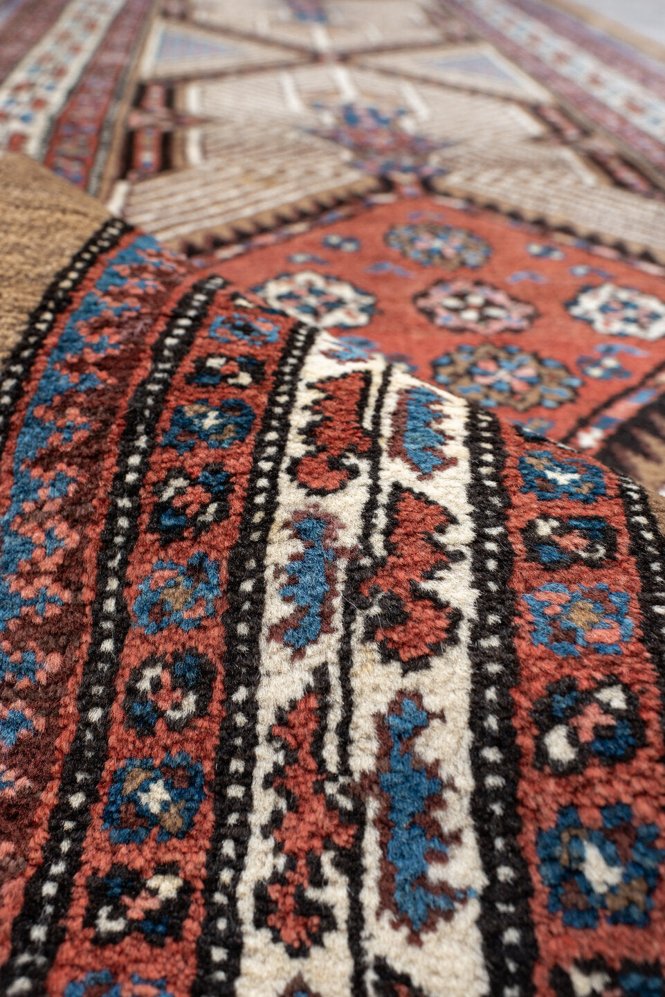 3' x 16' one-of-a-kind handmade antique Sarab runner rug. Color palette: ivory, rust, red, indigo, camel, navy, brown