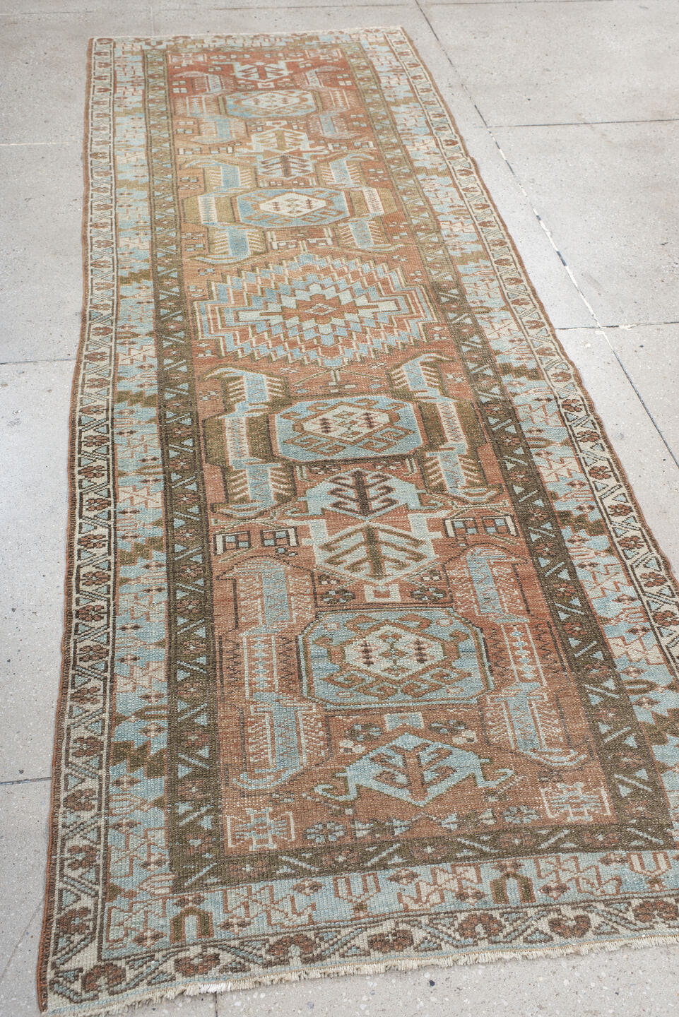 3' x 9' one-of-a-kind handmade antique Heriz runner rug. Color palette: terra cotta, sky blue, ivory, taupe, charcoal, sage