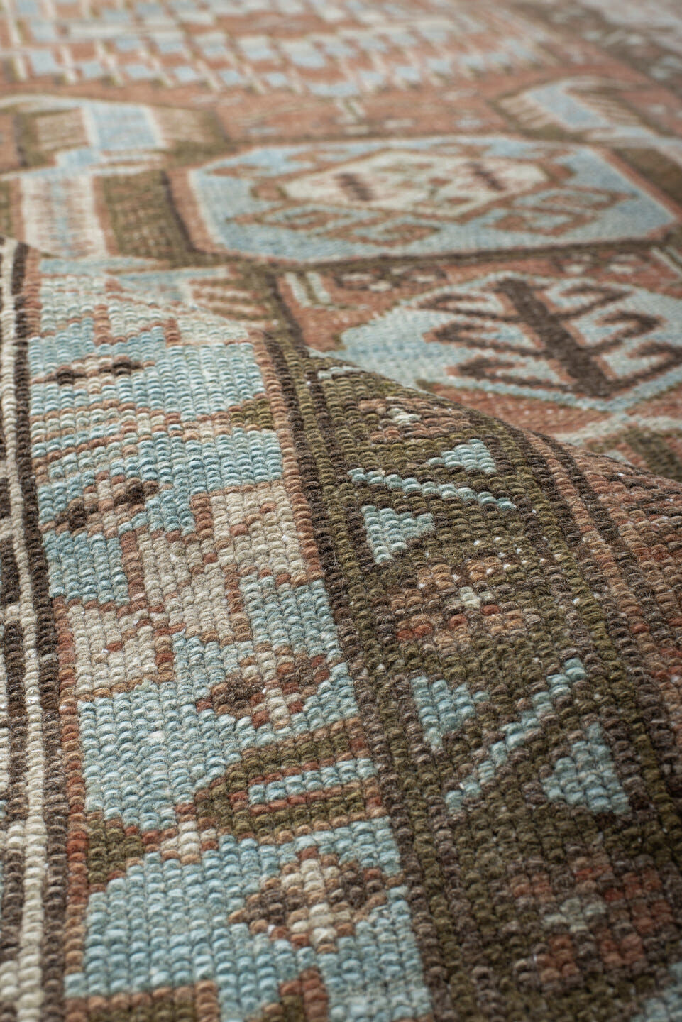 3' x 9' one-of-a-kind handmade antique Heriz runner rug. Color palette: terra cotta, sky blue, ivory, taupe, charcoal, sage