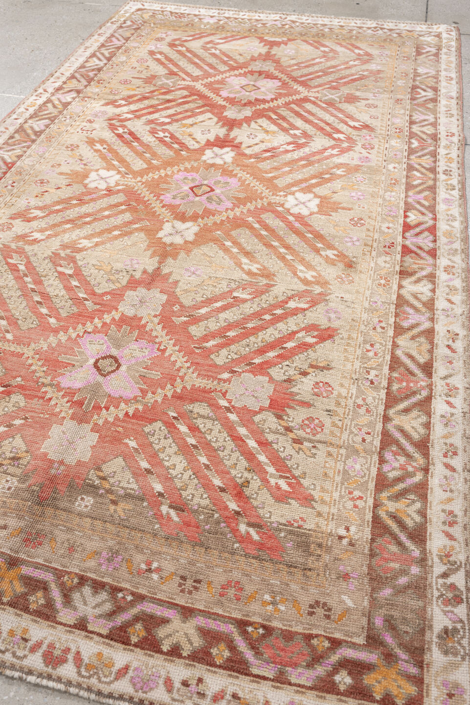 4' x 9' one-of-a-kind handmade antique Caucasian medium size rug. Color palette: ivory, terracotta, rose, taupe, blush