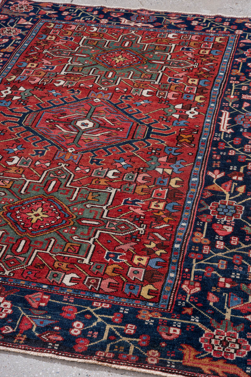 4' x 6' one-of-a-kind handmade vintage Karaje small size rug. Color palette: rust, navy, ivory, sky blue, sage, rose