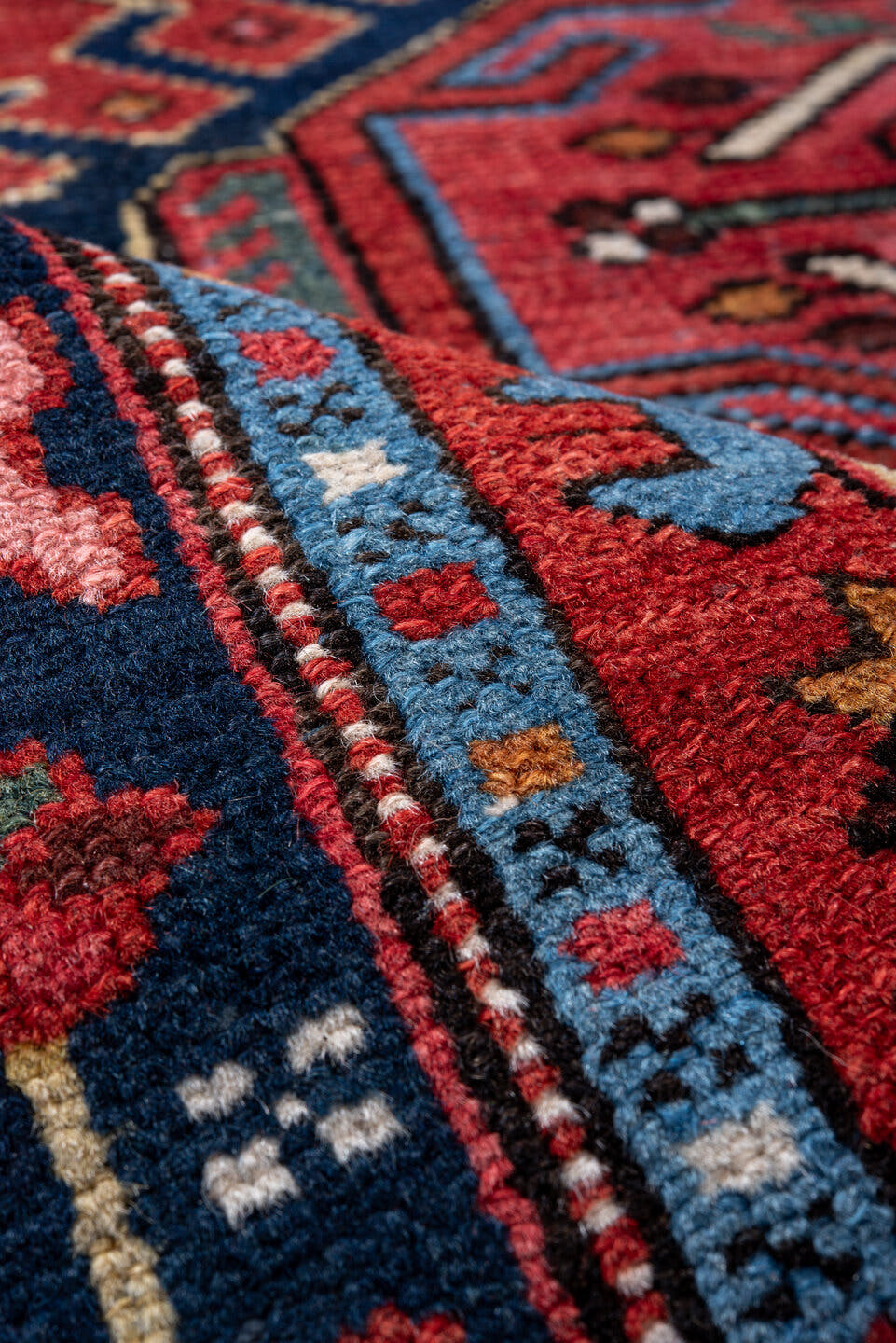 4' x 6' one-of-a-kind handmade vintage Karaje small size rug. Color palette: rust, navy, ivory, sky blue, sage, rose