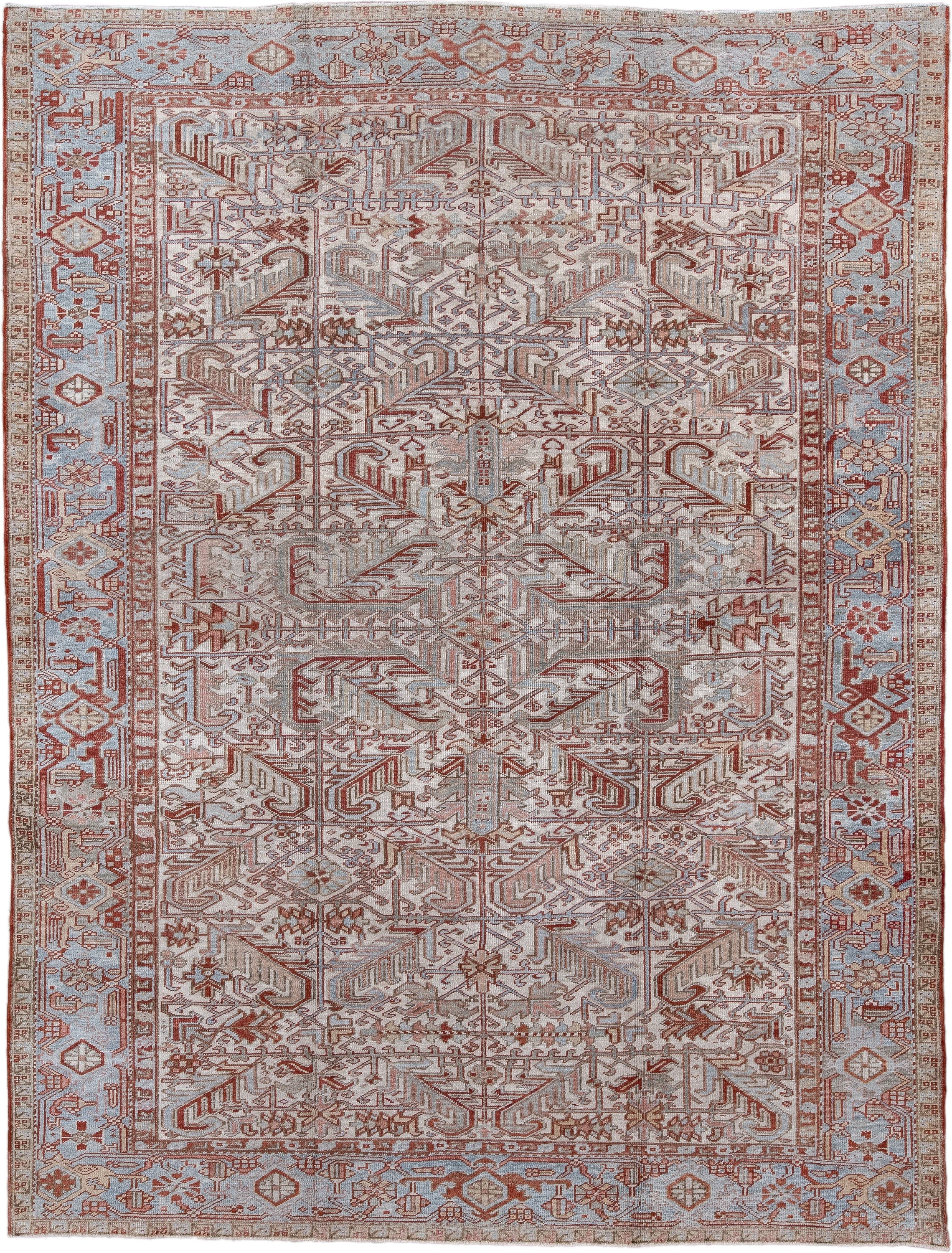 8' x 10' one-of-a-kind handmade antique Heriz large size rug. Color palette: pale blue, rust, ivory, taupe, camel