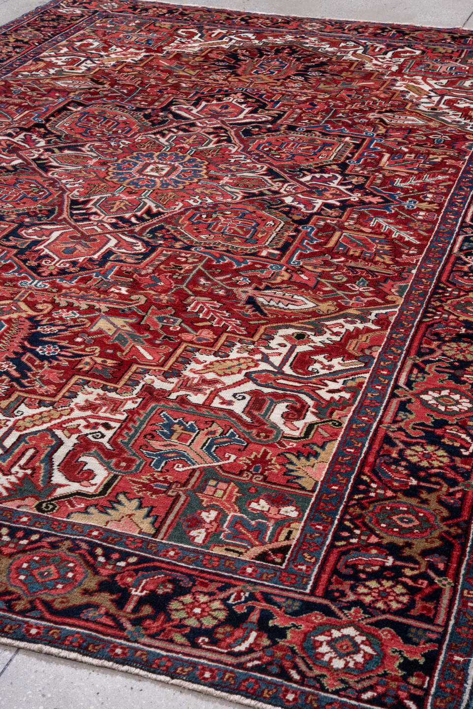 7' x 11' one-of-a-kind handmade vintage Heriz large size rug. Color palette: red, navy, ivory, rust, sky blue, burgundy