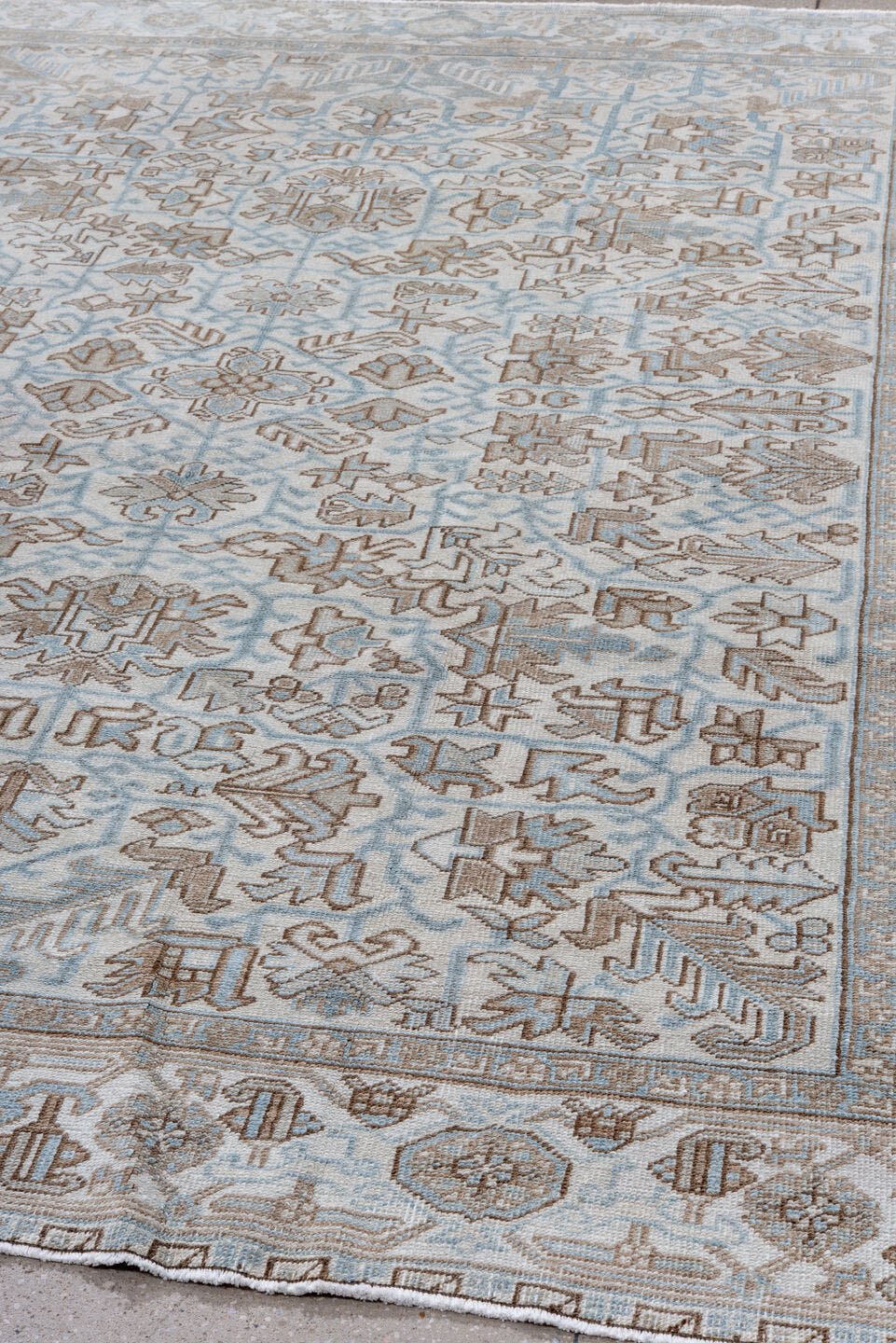 8' x 9' one-of-a-kind handmade antique Heriz rug. Color palette: ivory, pale blue, taupe, beige, light brown, light blue