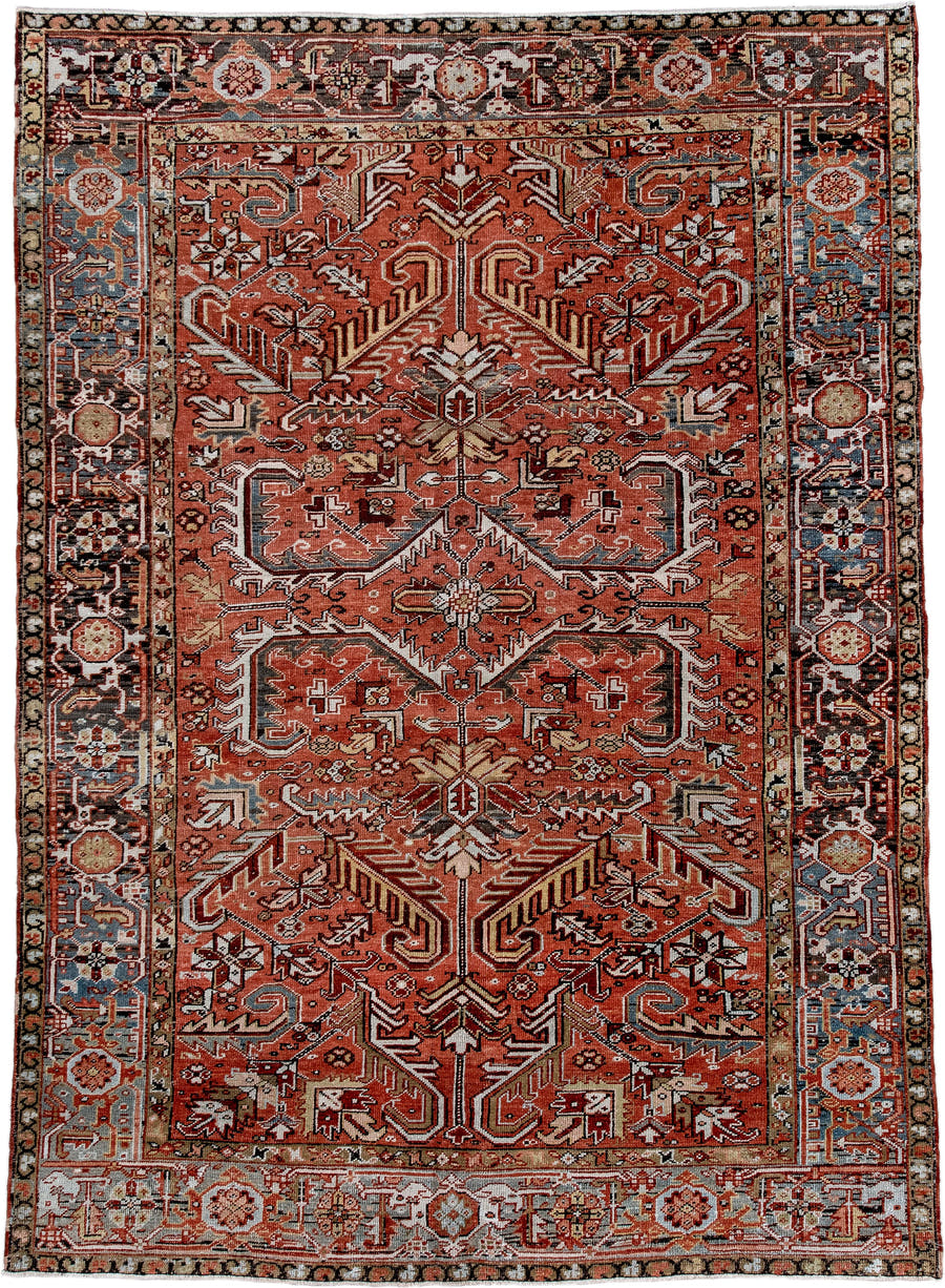 6' x 9' one-of-a-kind handmade antique Heriz rug. Color palette: terra cotta, rust, sky blue, ivory, charcoal, camel