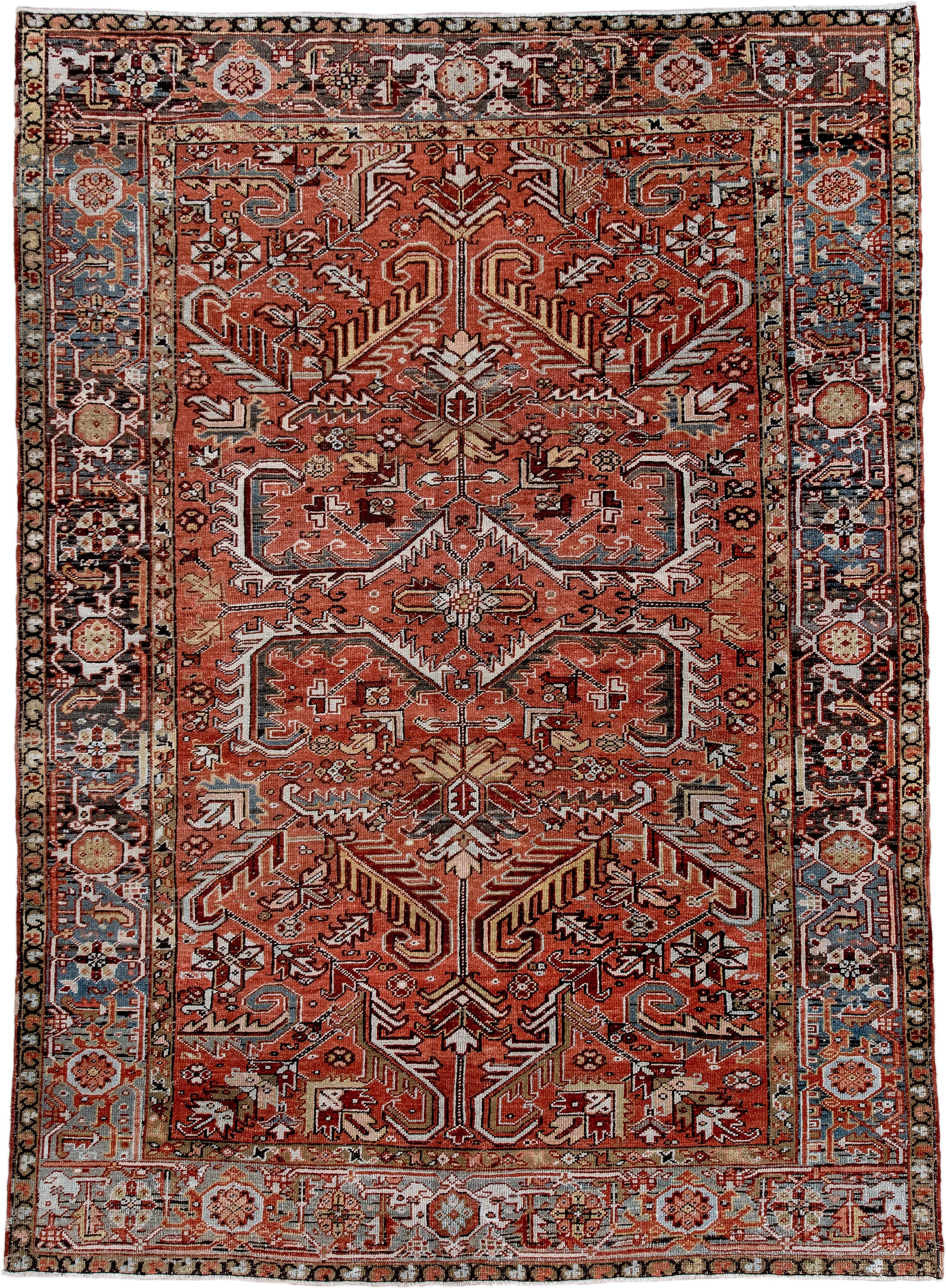 6' x 9' one-of-a-kind handmade antique Heriz rug. Color palette: terra cotta, rust, sky blue, ivory, charcoal, camel
