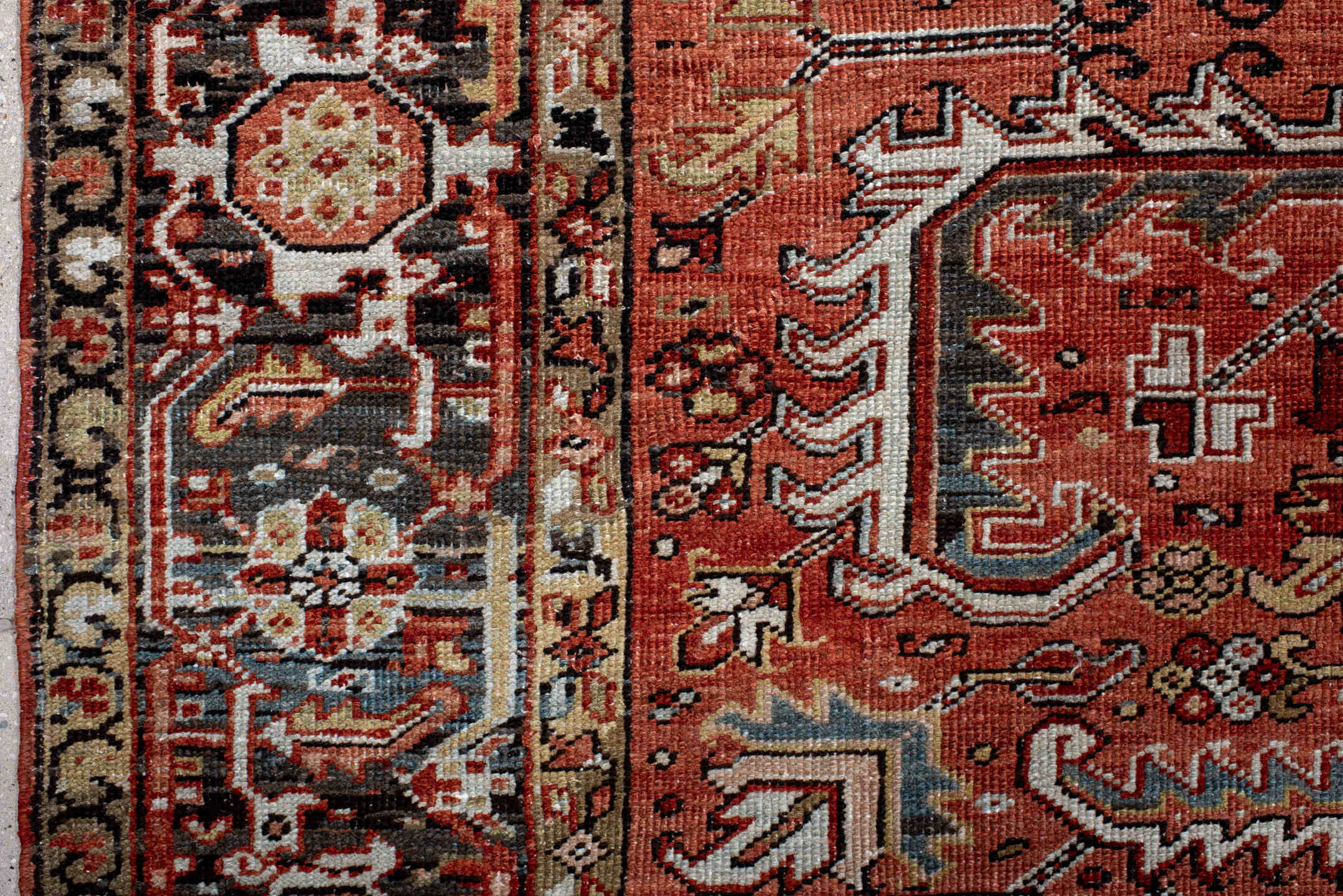 6' x 9' one-of-a-kind handmade antique Heriz rug. Color palette: terra cotta, rust, sky blue, ivory, charcoal, camel