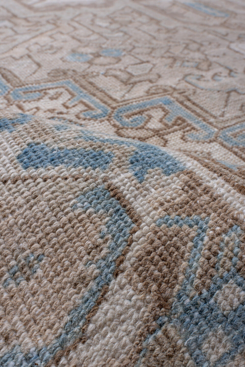7' x 11' one-of-a-kind handmade antique Heriz large size rug. Color palette: taupe, ivory, powder blue, beige, camel