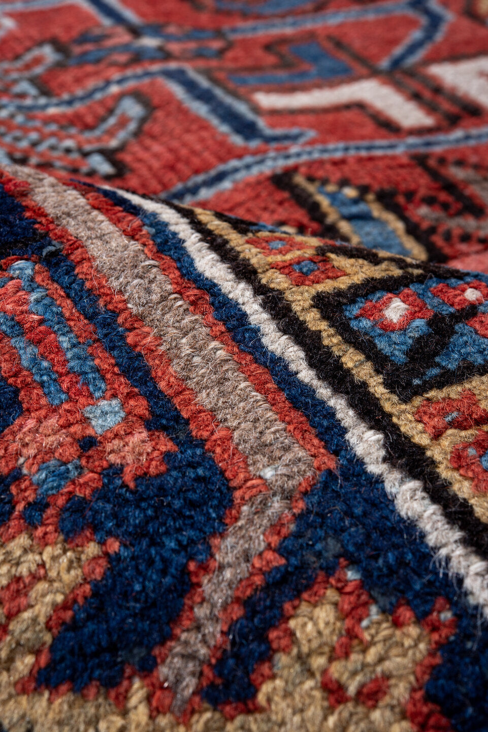 7' x 9' one-of-a-kind handmade vintage Heriz rug. Color palette: black, blue, brown, charcoal, gainsboro, gray, indian red