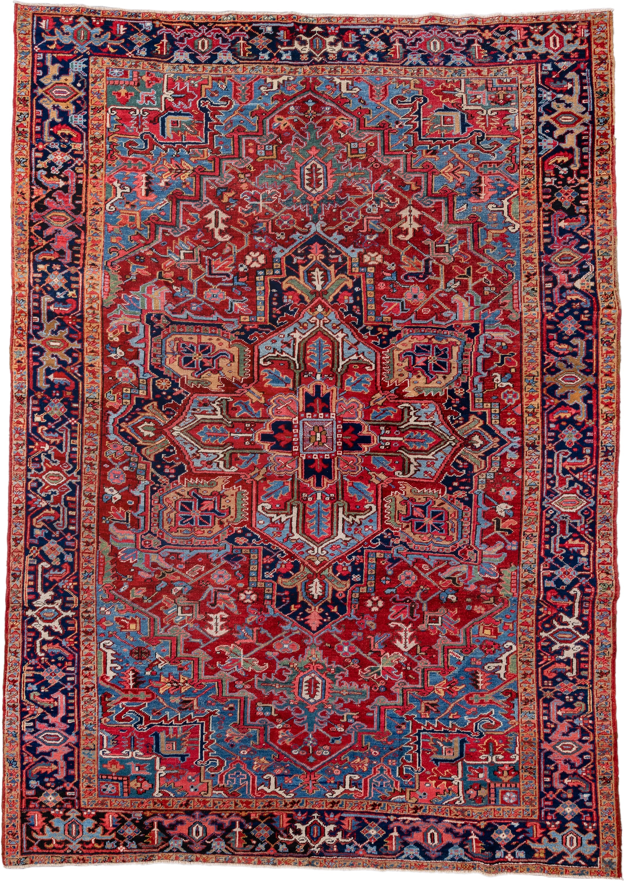7' x 10' one-of-a-kind handmade vintage Heriz large size rug. Color palette: red, navy, sky blue, ivory, rust, coral, camel