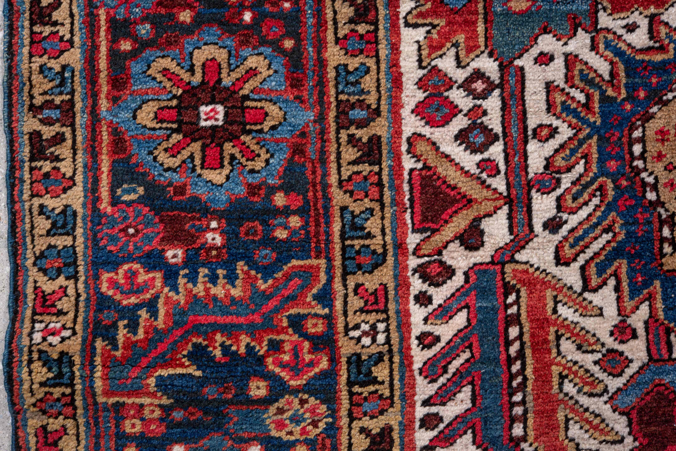 5' x 9' one-of-a-kind handmade vintage Heriz medium size rug. Color palette: ivory, navy, crimson, sky blue, camel, rust