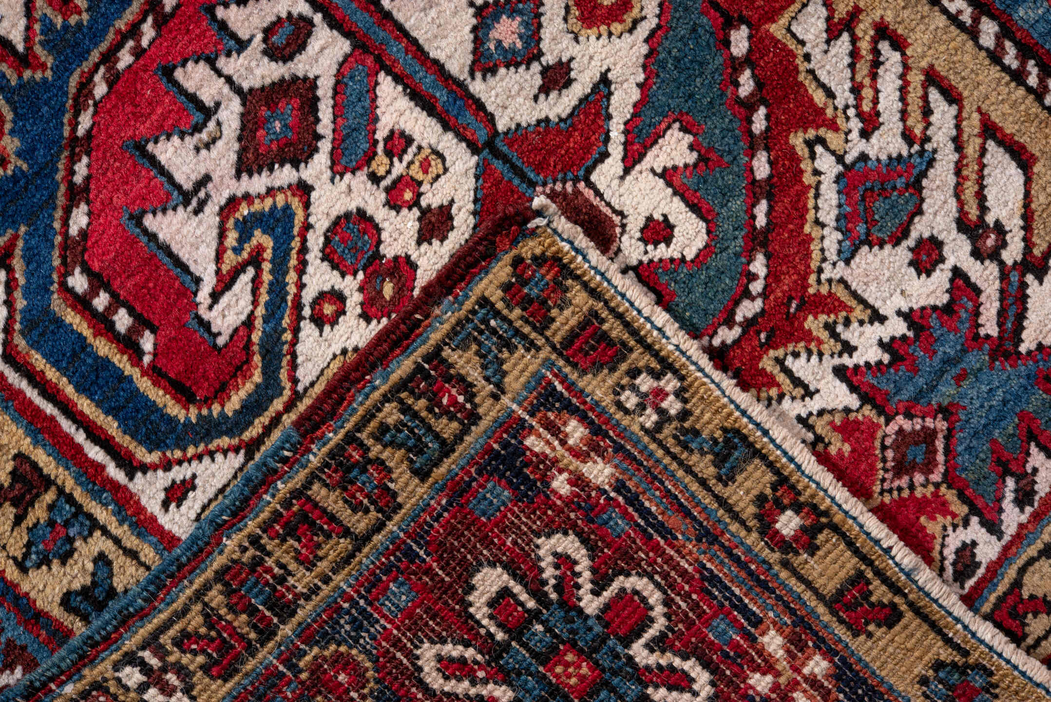 5' x 9' one-of-a-kind handmade vintage Heriz medium size rug. Color palette: ivory, navy, crimson, sky blue, camel, rust