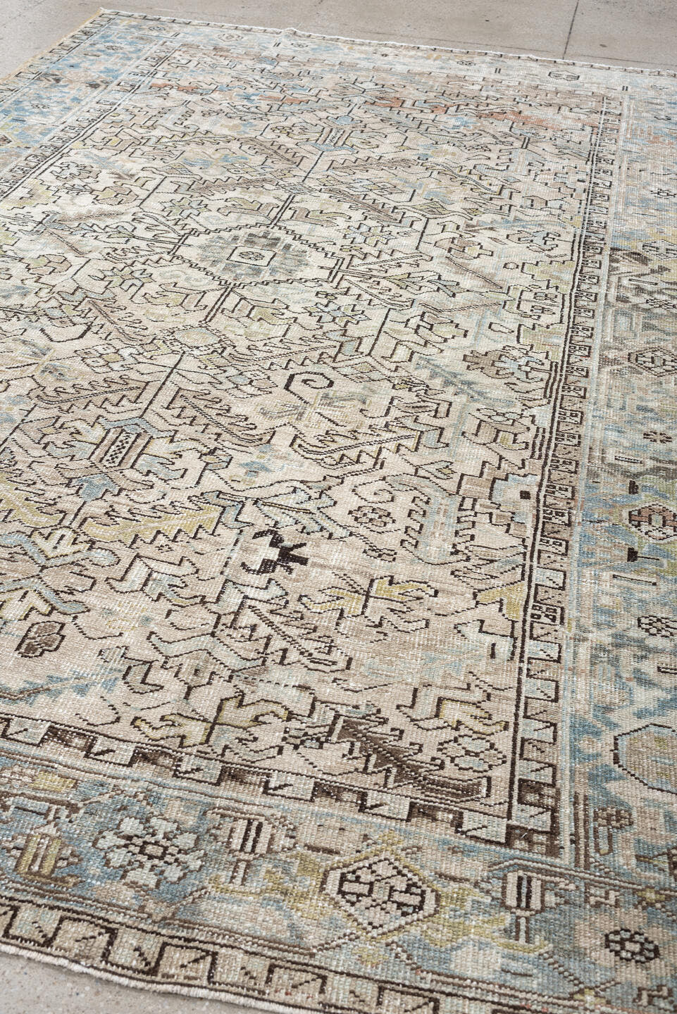 7' x 10' one-of-a-kind handmade vintage Heriz large size rug. Color palette: ivory, sky blue, taupe, charcoal, blush