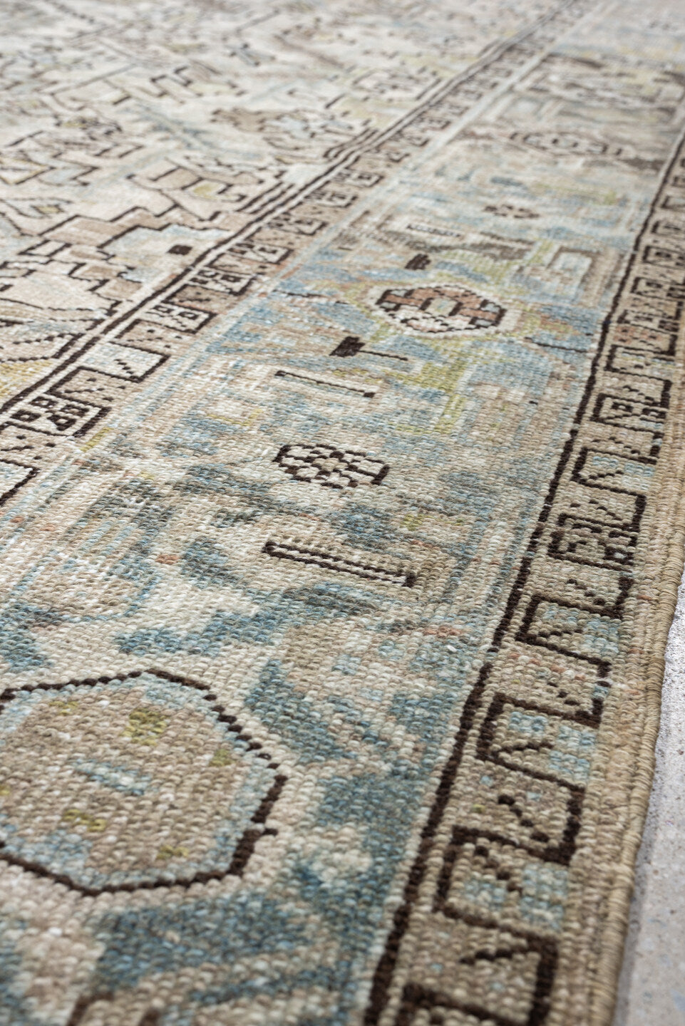 7' x 10' one-of-a-kind handmade vintage Heriz large size rug. Color palette: ivory, sky blue, taupe, charcoal, blush