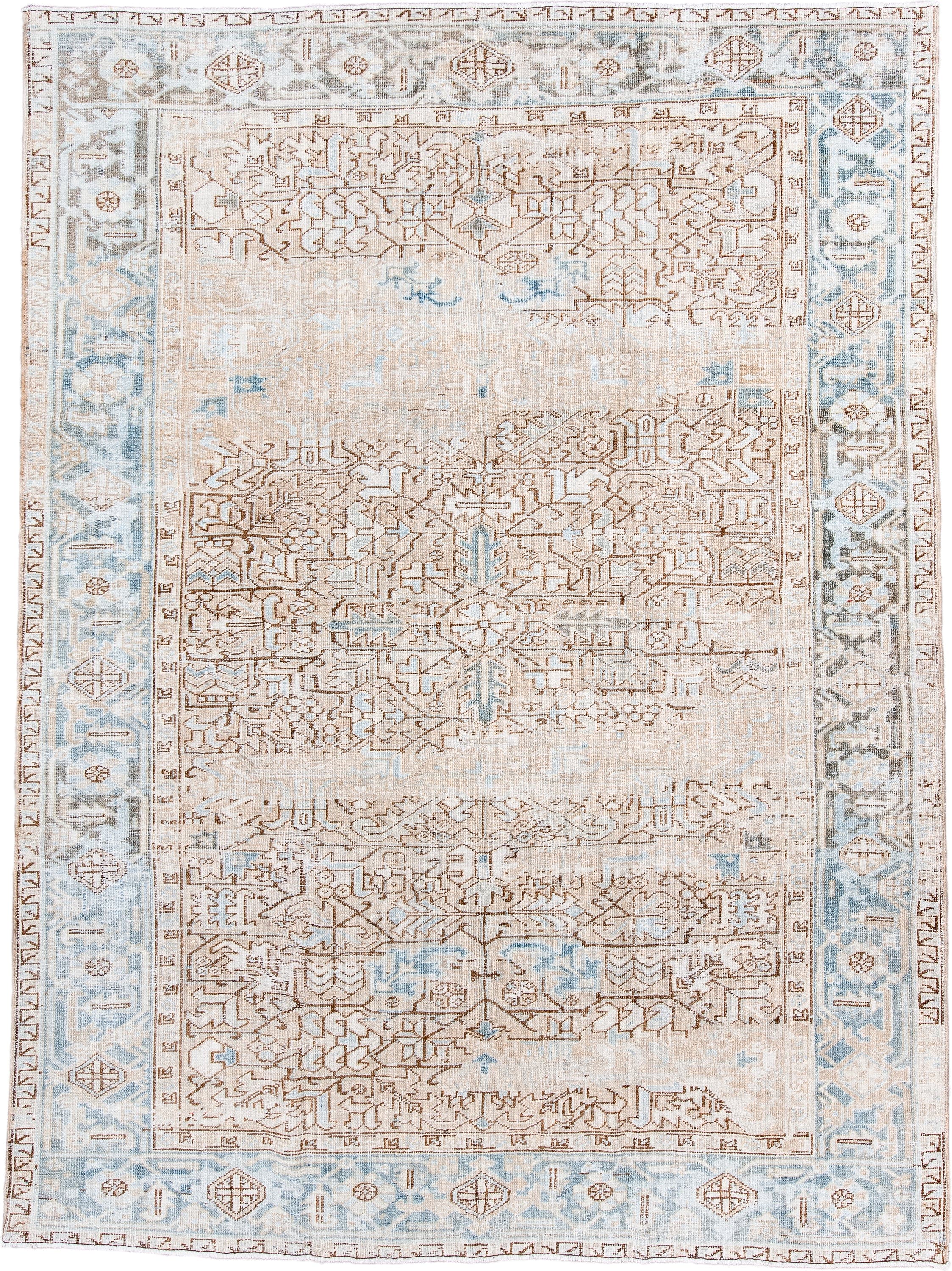 7' x 10' one-of-a-kind handmade antique Heriz large size rug. Color palette: ivory, pale blue, camel, light brown, taupe