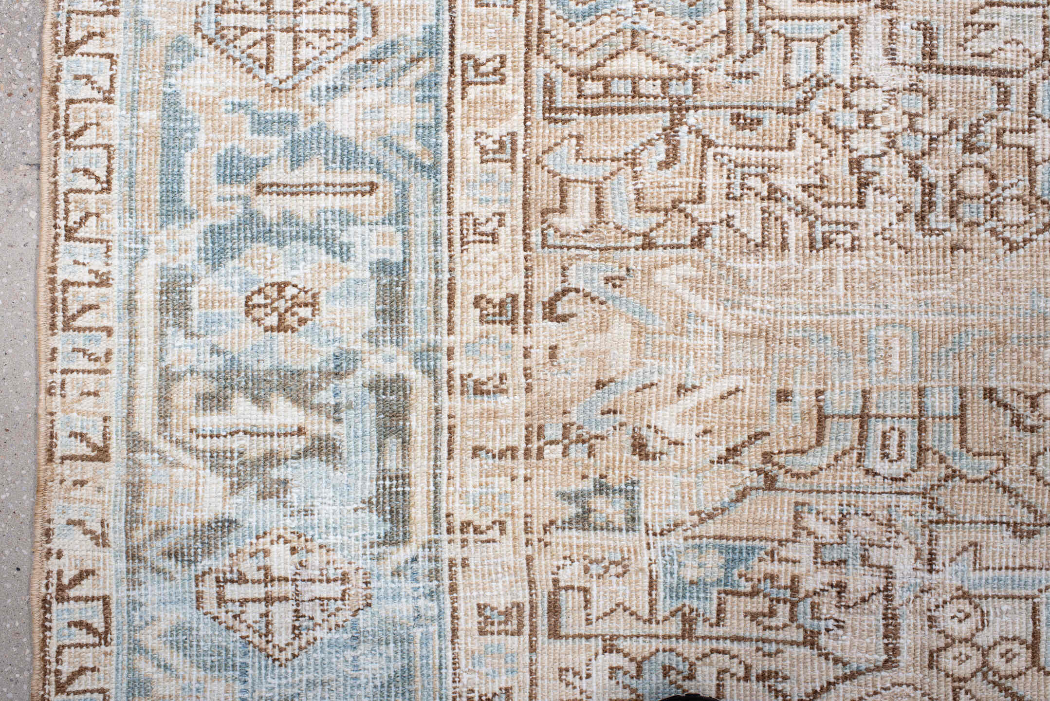 7' x 10' one-of-a-kind handmade antique Heriz large size rug. Color palette: ivory, pale blue, camel, light brown, taupe