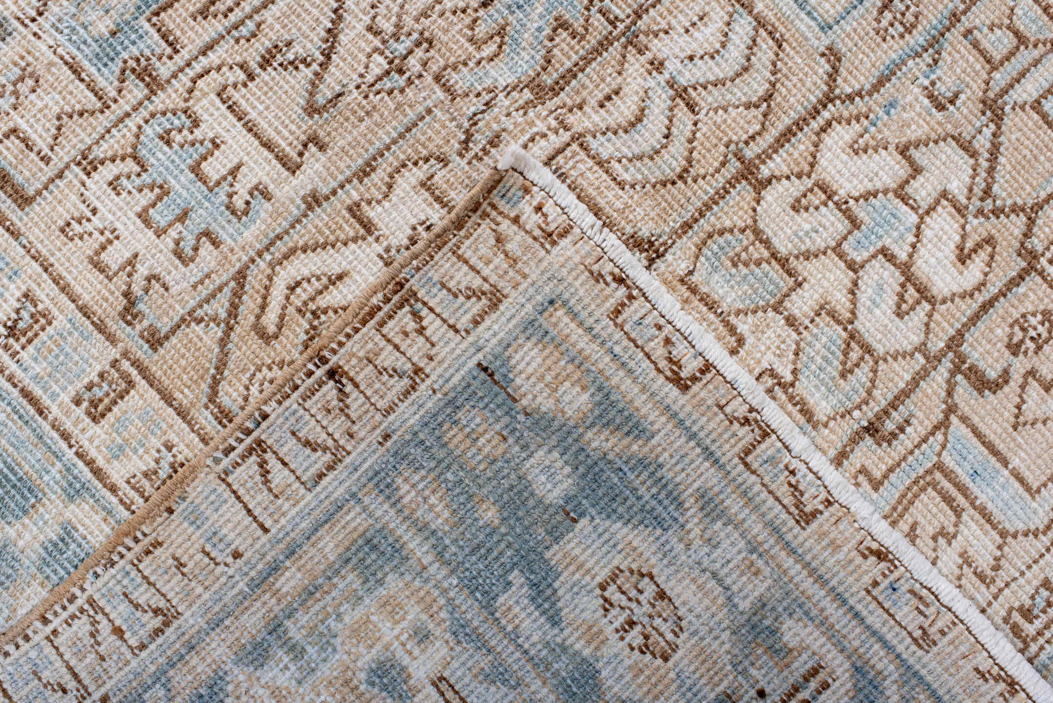 7' x 10' one-of-a-kind handmade antique Heriz large size rug. Color palette: ivory, pale blue, camel, light brown, taupe
