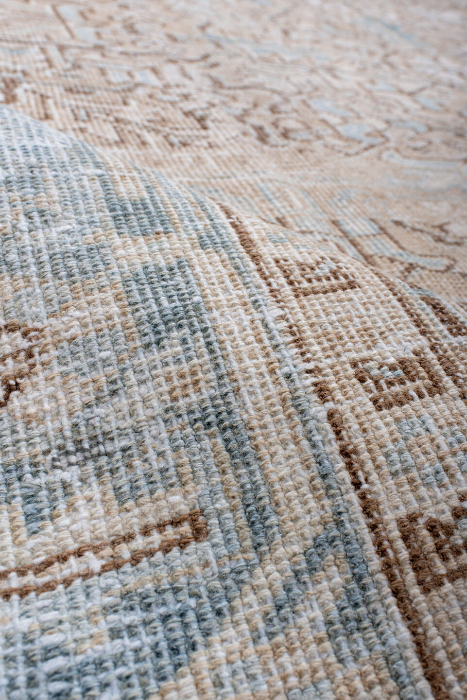 7' x 10' one-of-a-kind handmade antique Heriz large size rug. Color palette: ivory, pale blue, camel, light brown, taupe