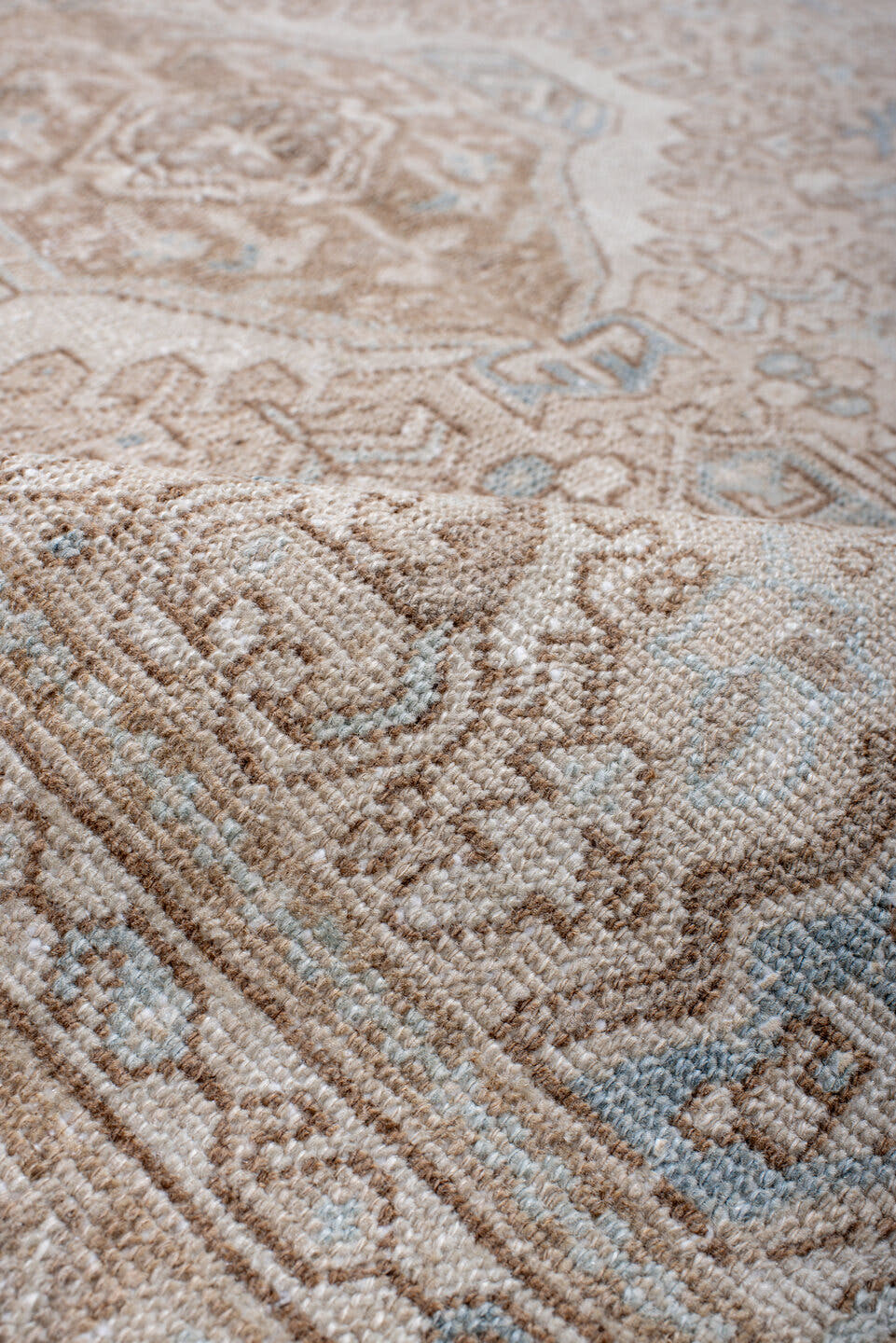 4' x 6' one-of-a-kind handmade antique Karaje rug. Color palette: camel, ivory, sky blue, taupe, beige, light blue, gray