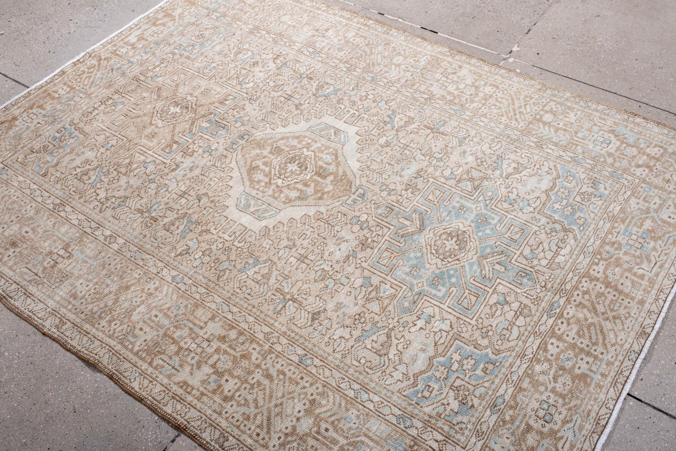 4' x 6' one-of-a-kind handmade antique Karaje rug. Color palette: camel, ivory, sky blue, taupe, beige, light blue, gray