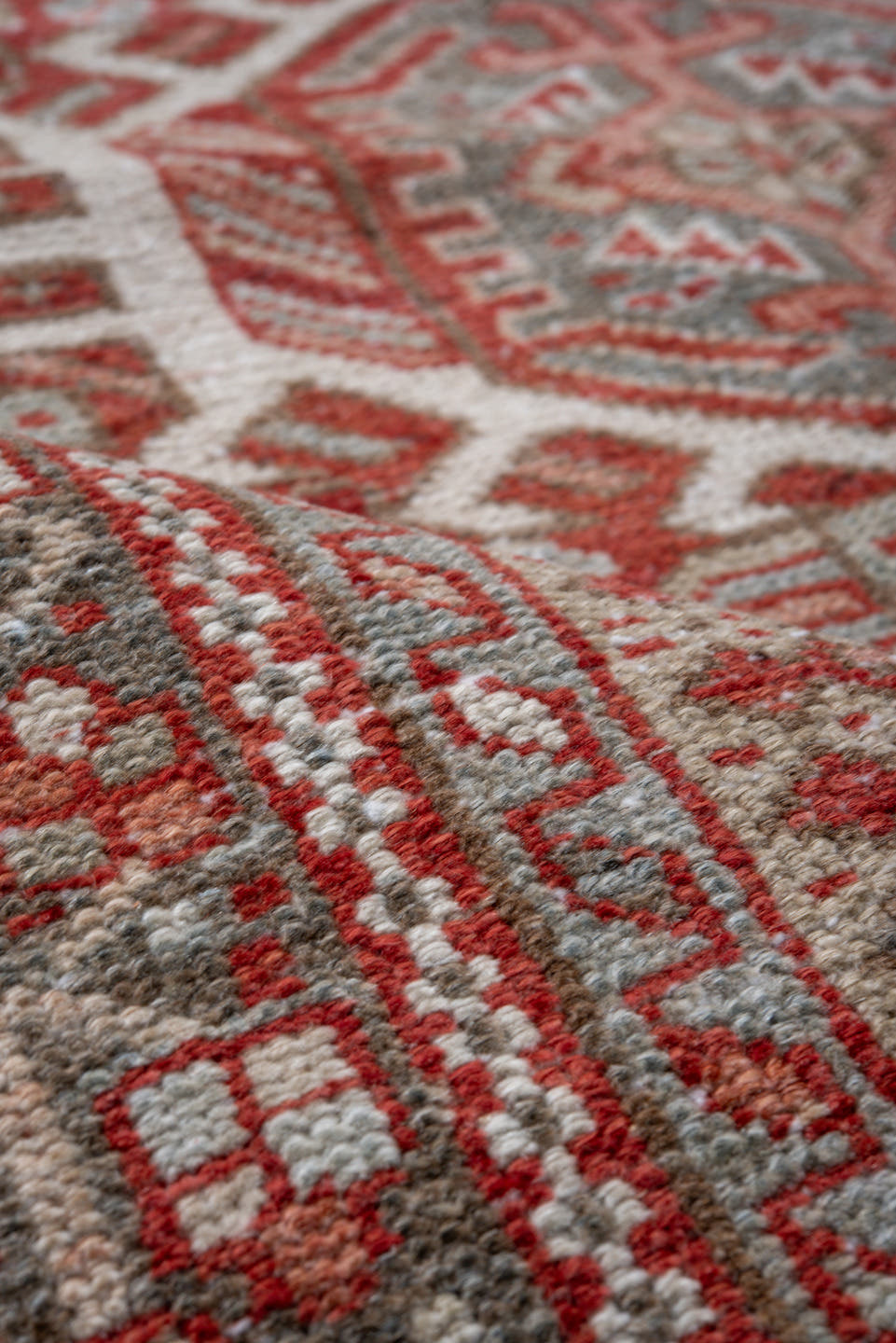 5' x 6' one-of-a-kind handmade vintage Karaje rug. Color palette: gray, rust, ivory, brick, taupe, terracotta, brown, red