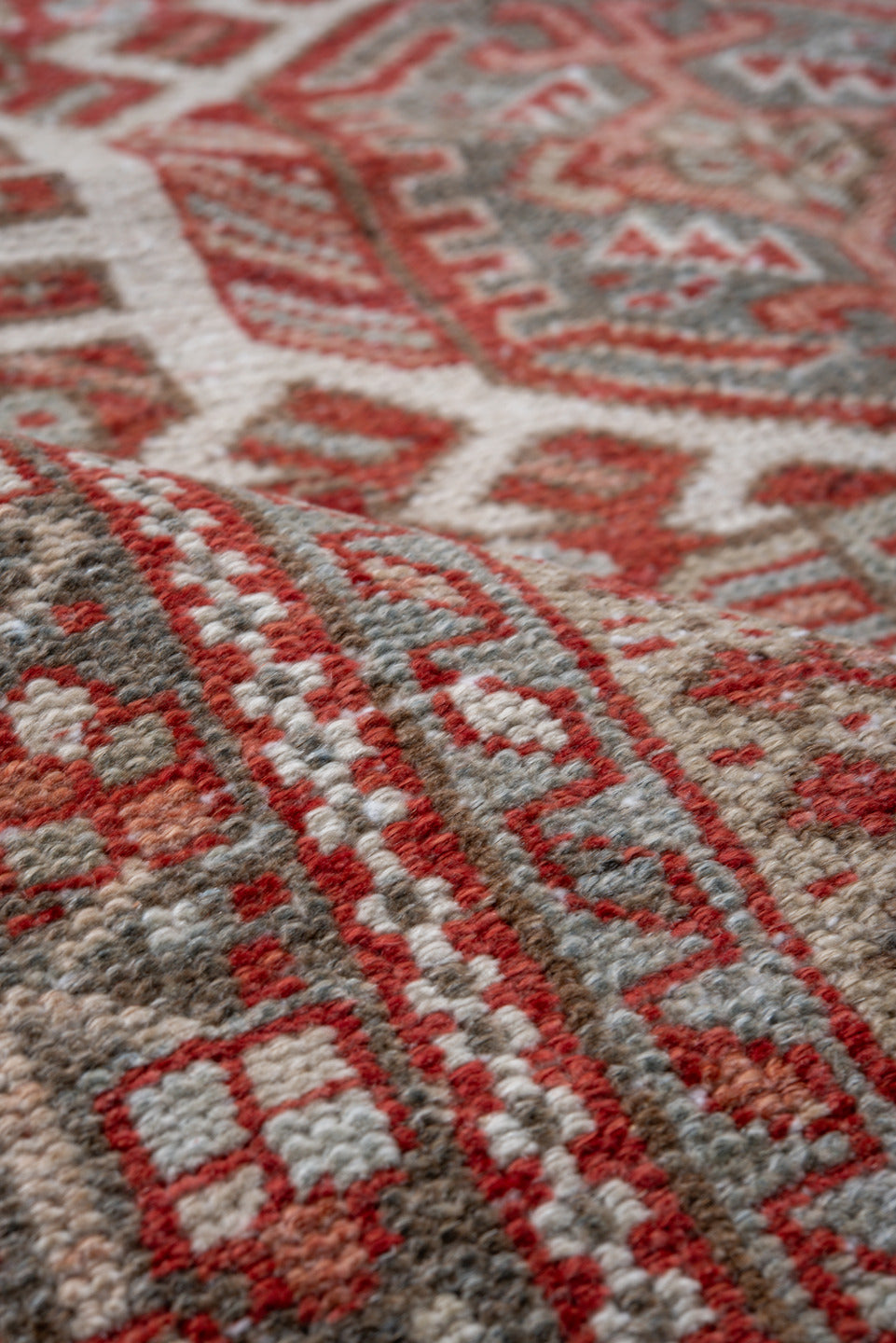 5' x 6' one-of-a-kind handmade vintage Karaje rug. Color palette: gray, rust, ivory, brick, taupe, terracotta, brown, red