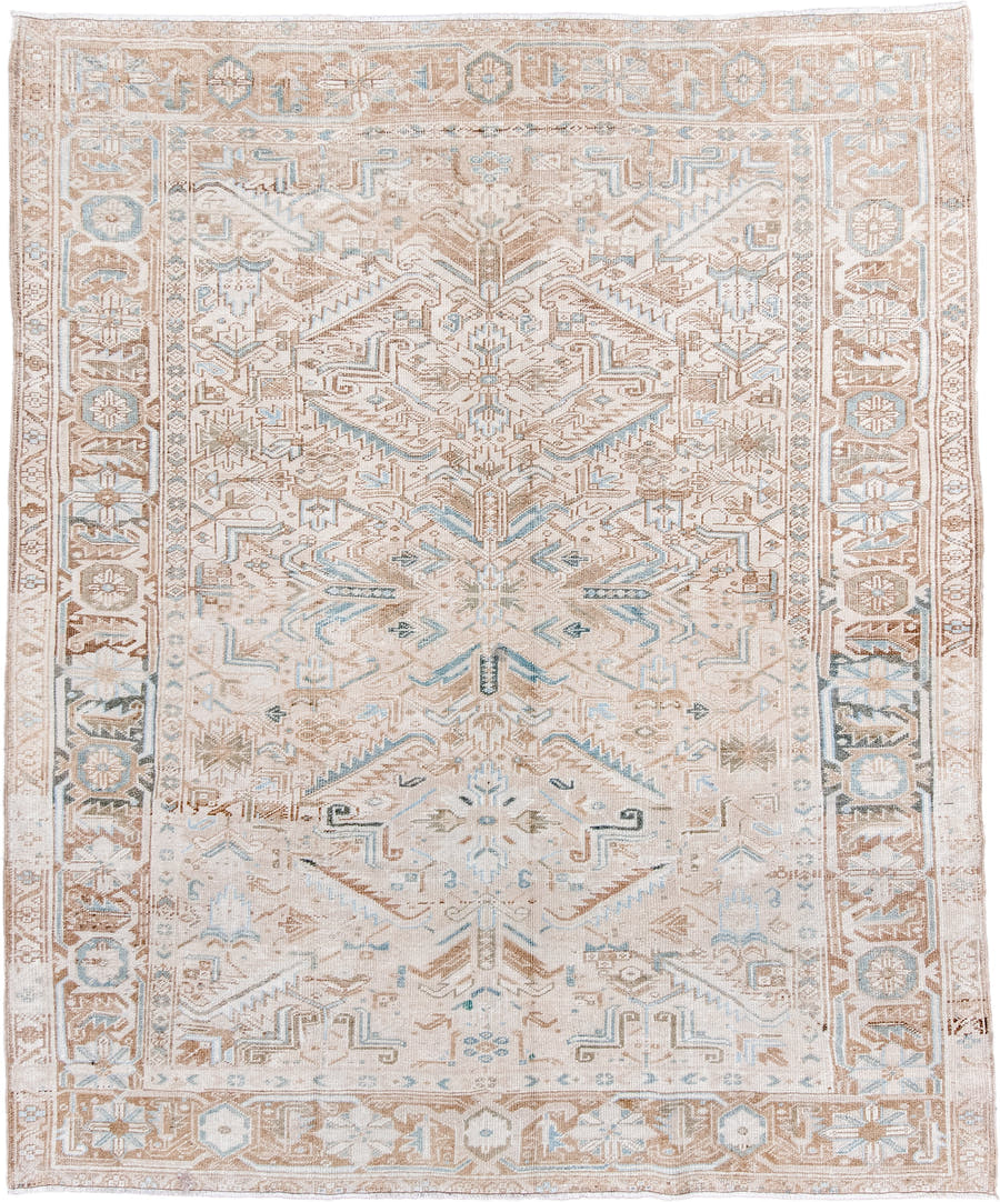 7' x 8' one-of-a-kind handmade antique Heriz rug. Color palette: ivory, camel, pale blue, taupe, beige, light brown