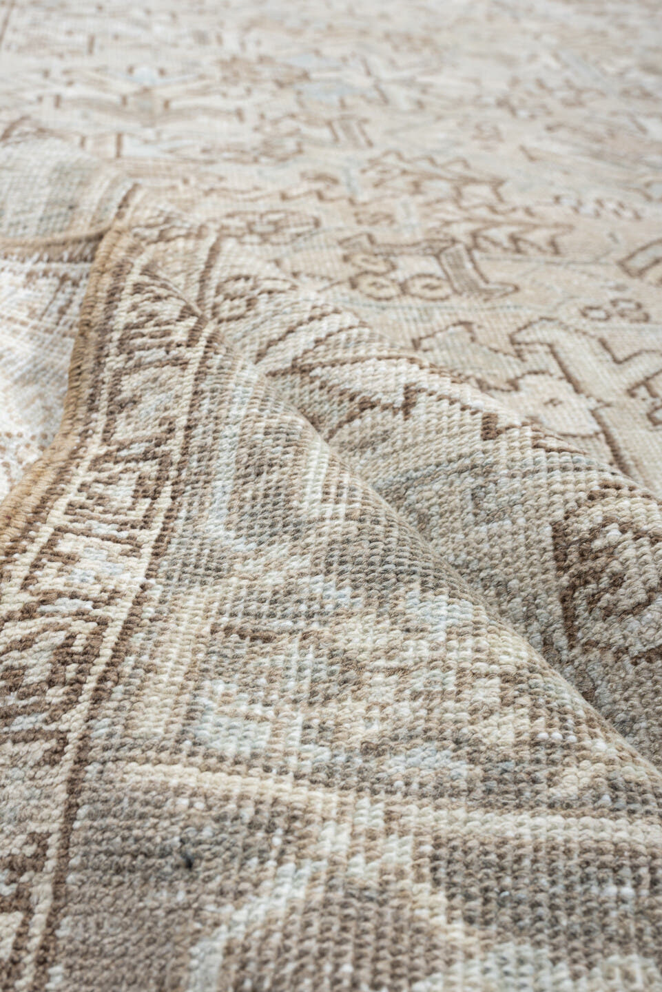 7' x 8' one-of-a-kind handmade vintage Heriz rug. Color palette: ivory, pale blue, taupe, beige, light gray, camel