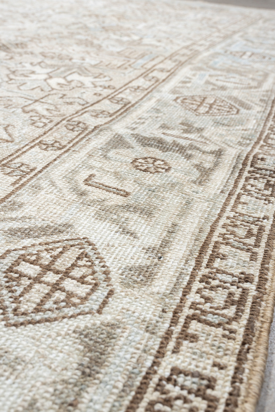 7' x 8' one-of-a-kind handmade vintage Heriz rug. Color palette: ivory, pale blue, taupe, beige, light gray, camel