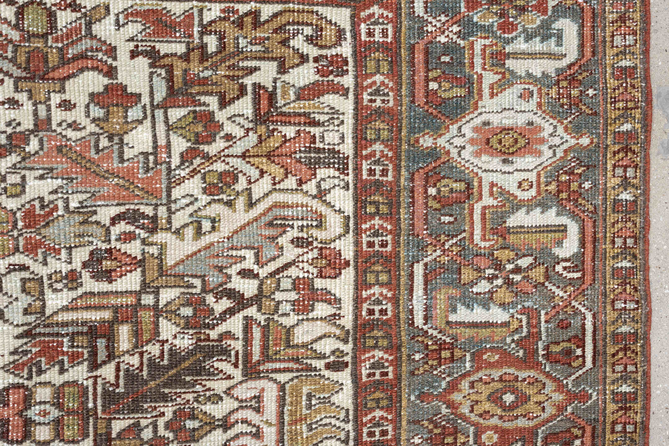 7' x 9' one-of-a-kind handmade vintage Heriz rug. Color palette: ivory, blue gray, rust, camel, sage, terracotta, taupe