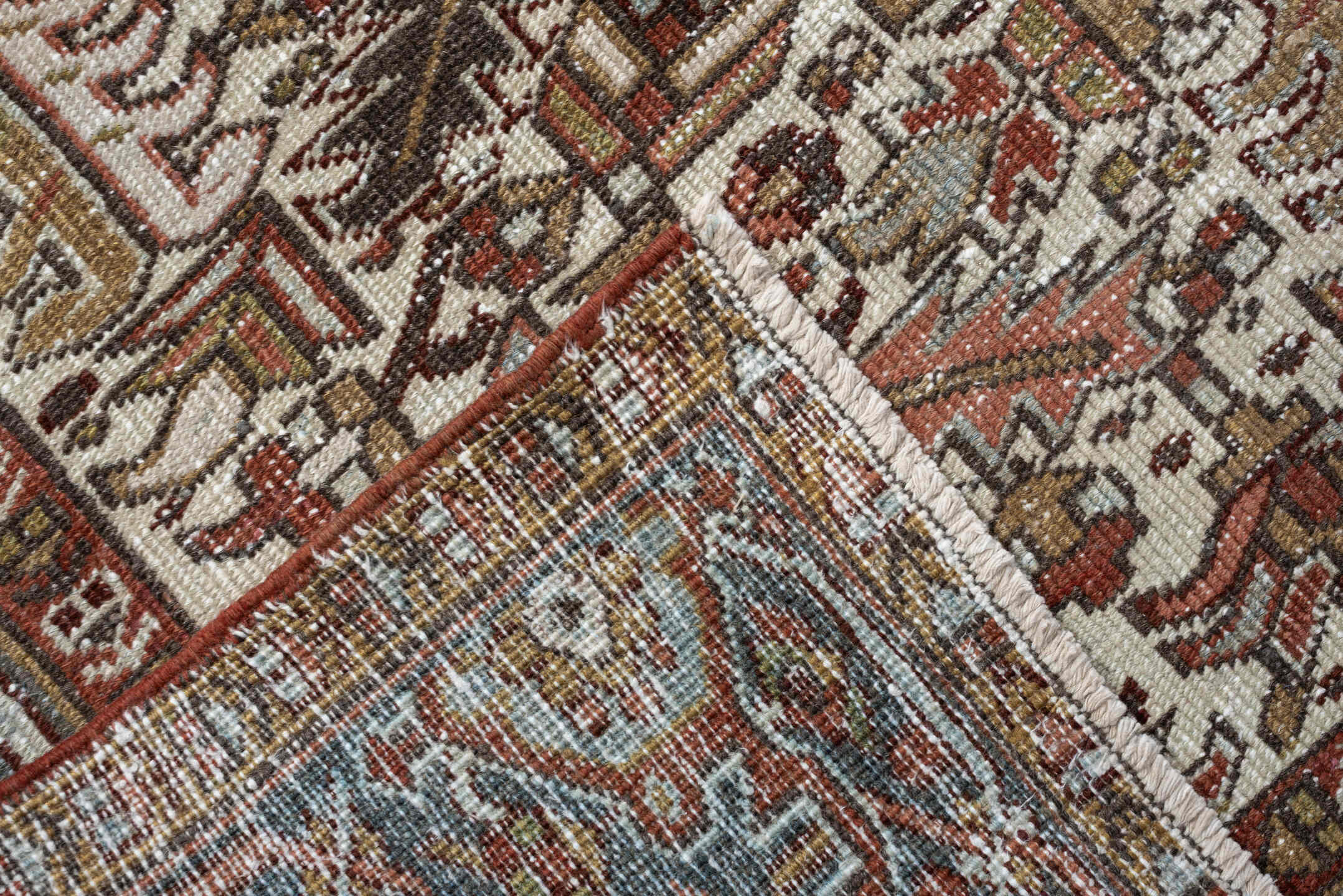 7' x 9' one-of-a-kind handmade vintage Heriz rug. Color palette: ivory, blue gray, rust, camel, sage, terracotta, taupe