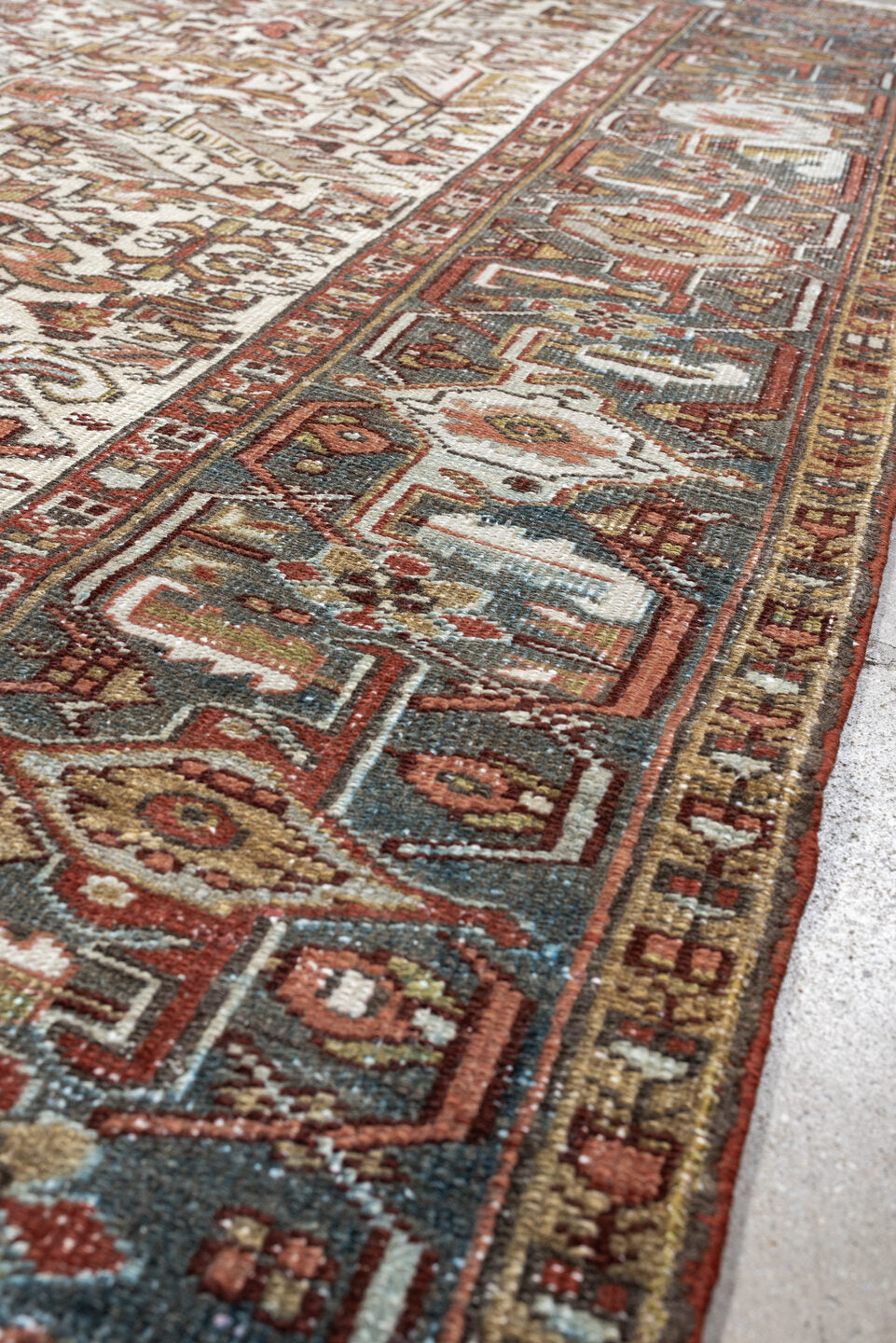 7' x 9' one-of-a-kind handmade vintage Heriz rug. Color palette: ivory, blue gray, rust, camel, sage, terracotta, taupe