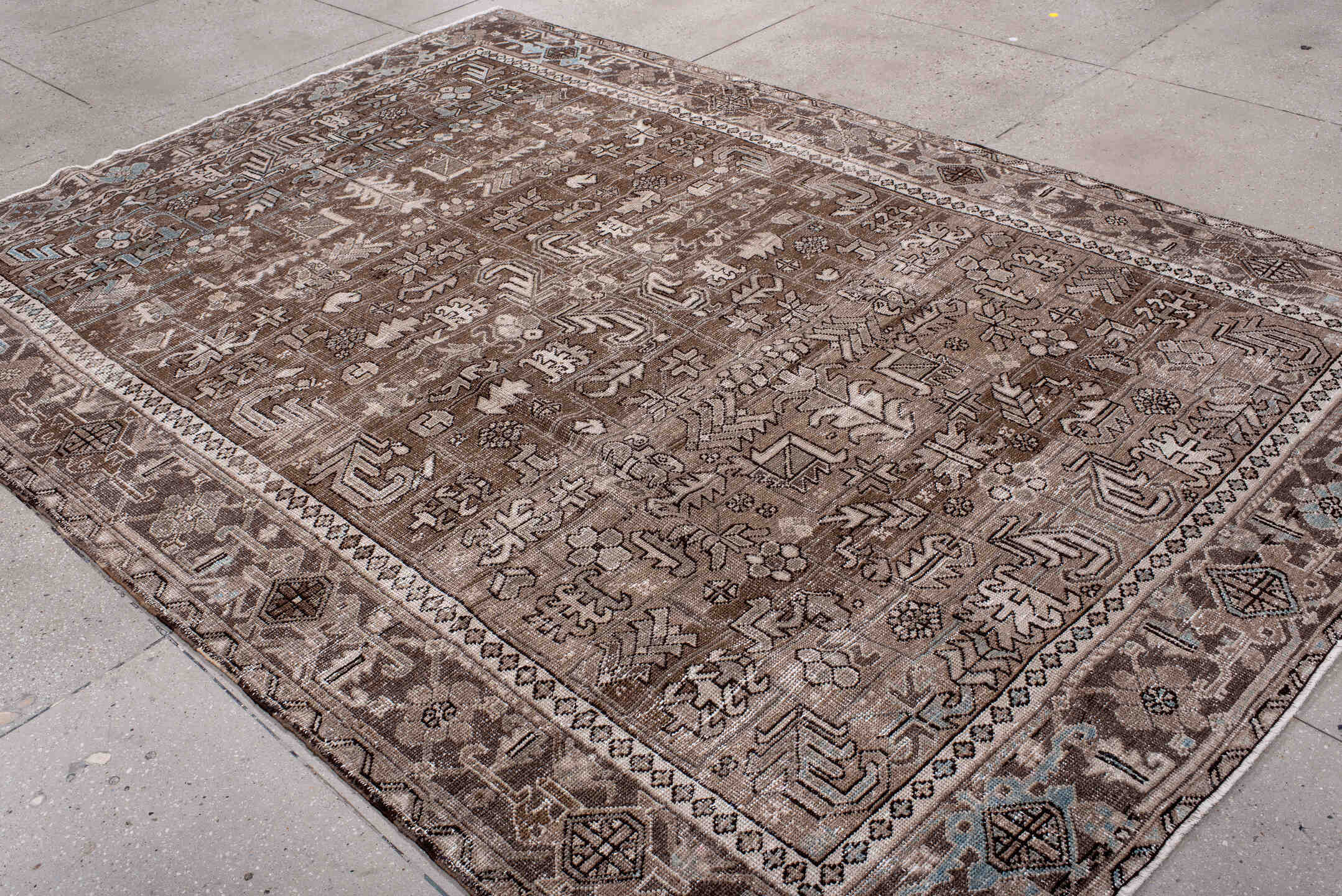 7' x 10' one-of-a-kind handmade antique Heriz large size rug. Color palette: brown, taupe, ivory, camel, slate, pale blue