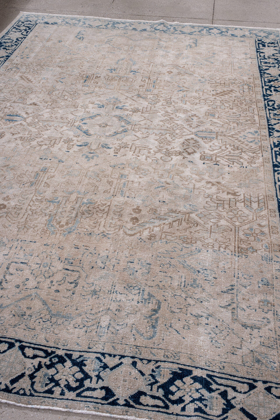 7' x 10' one-of-a-kind handmade antique Heriz large size rug. Color palette: ivory, navy, taupe, slate, beige, powder_blue