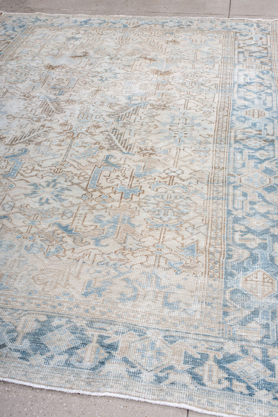 7' x 10' one-of-a-kind handmade antique Heriz large size rug. Color palette: ivory, sky blue, taupe, beige, camel