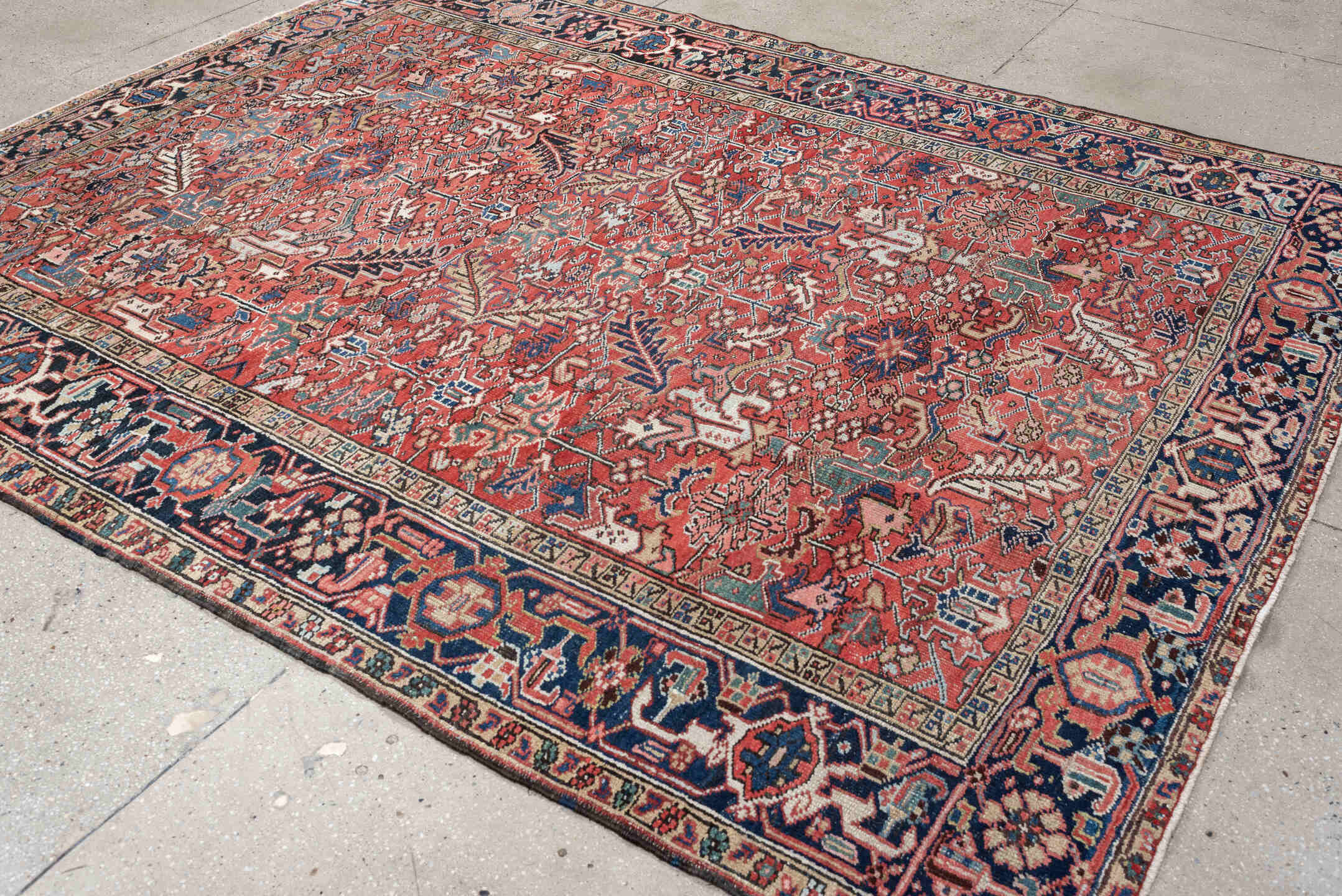7' x 9' one-of-a-kind handmade vintage Heriz rug. Color palette: terracotta, navy, ivory, sky blue, slate blue, coral, camel