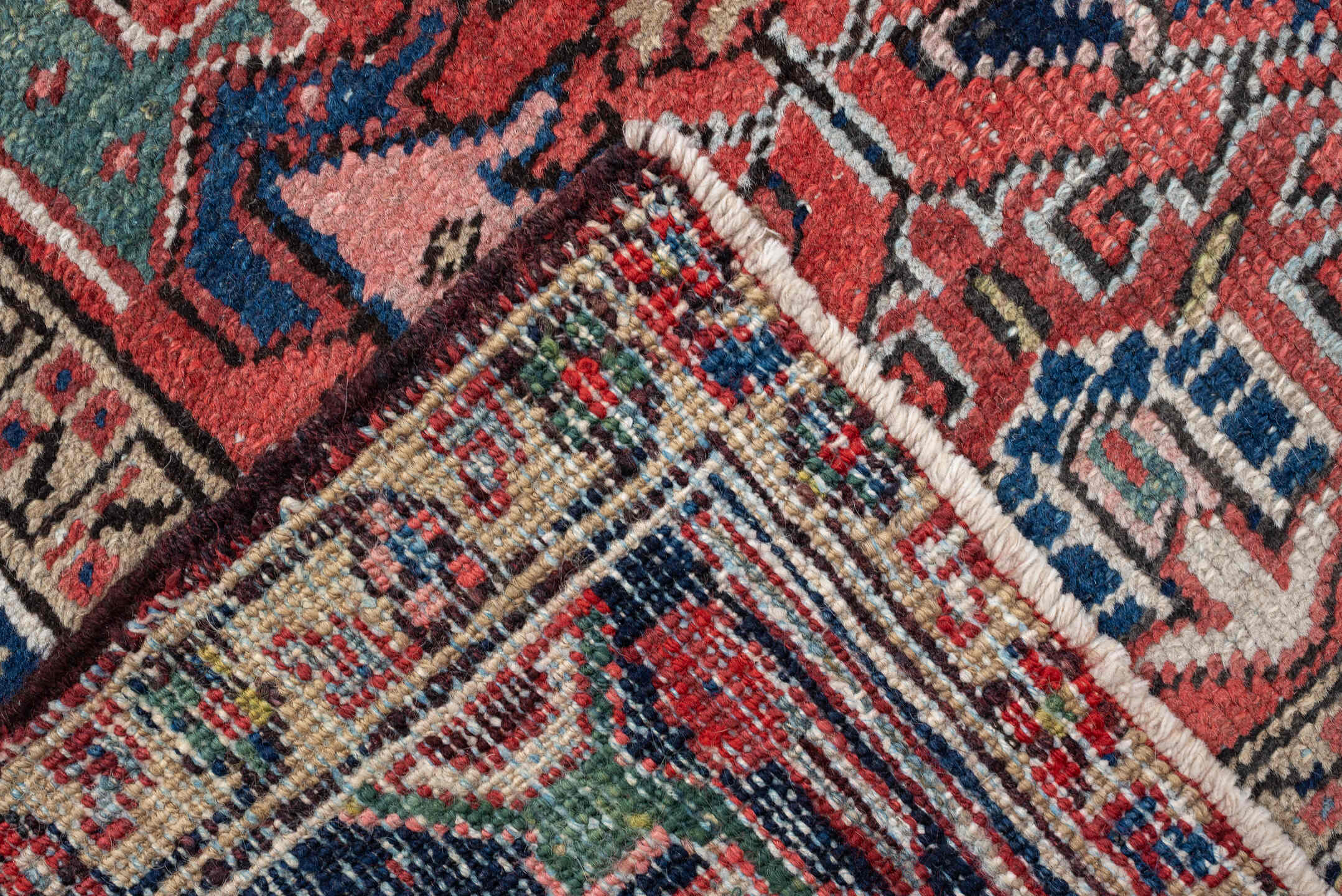 7' x 9' one-of-a-kind handmade vintage Heriz rug. Color palette: terracotta, navy, ivory, sky blue, slate blue, coral, camel