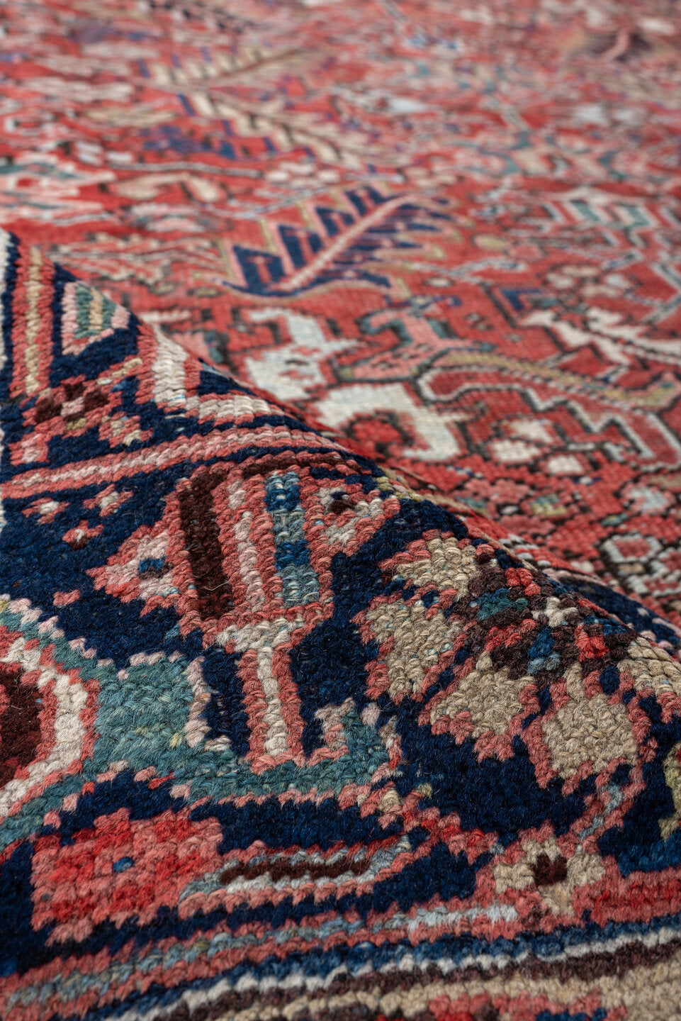 7' x 9' one-of-a-kind handmade vintage Heriz rug. Color palette: terracotta, navy, ivory, sky blue, slate blue, coral, camel