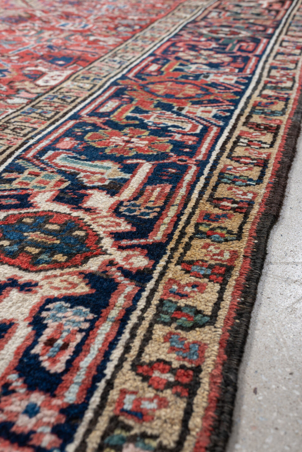 7' x 9' one-of-a-kind handmade vintage Heriz rug. Color palette: terracotta, navy, ivory, sky blue, slate blue, coral, camel