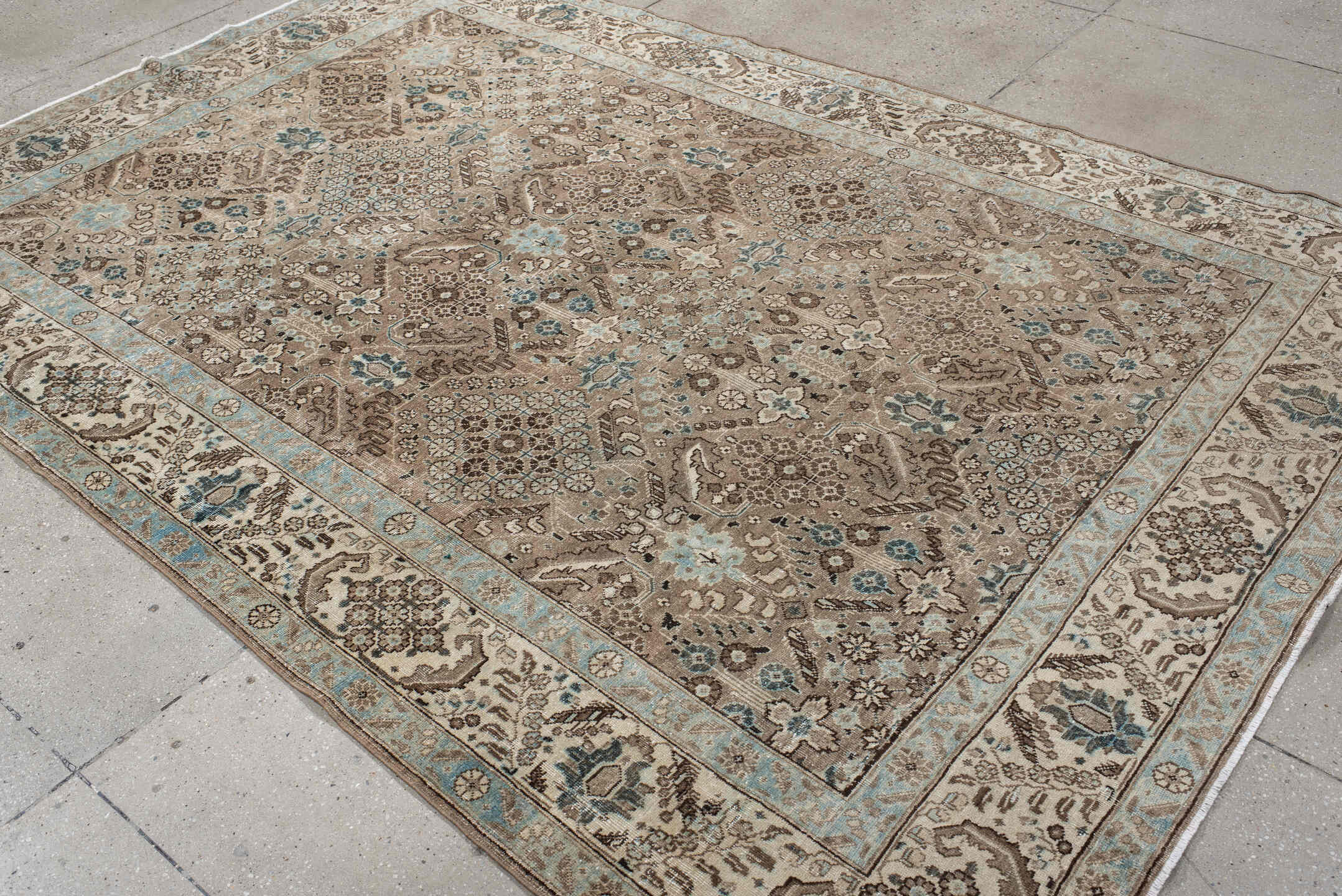 6' x 9' one-of-a-kind handmade antique Tabriz medium size rug. Color palette: taupe, ivory, pale blue, brown, beige, slate