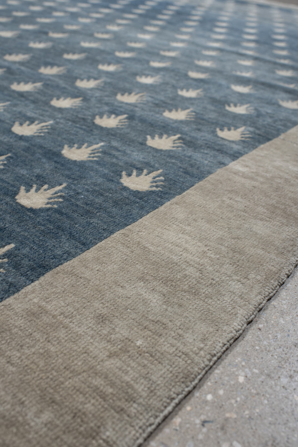7' x 9' one-of-a-kind handmade vintage Tibetan rug. Color palette: blue, ivory, cream, taupe, gray, beige