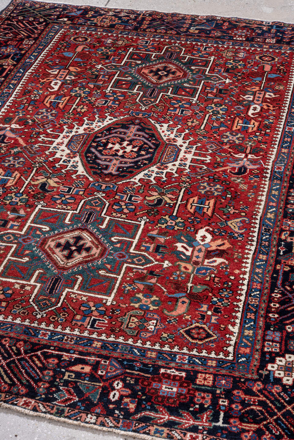 4' x 6' one-of-a-kind handmade vintage Karaje rug. Color palette: red, navy, ivory, sky blue, teal, rose, coral, charcoal