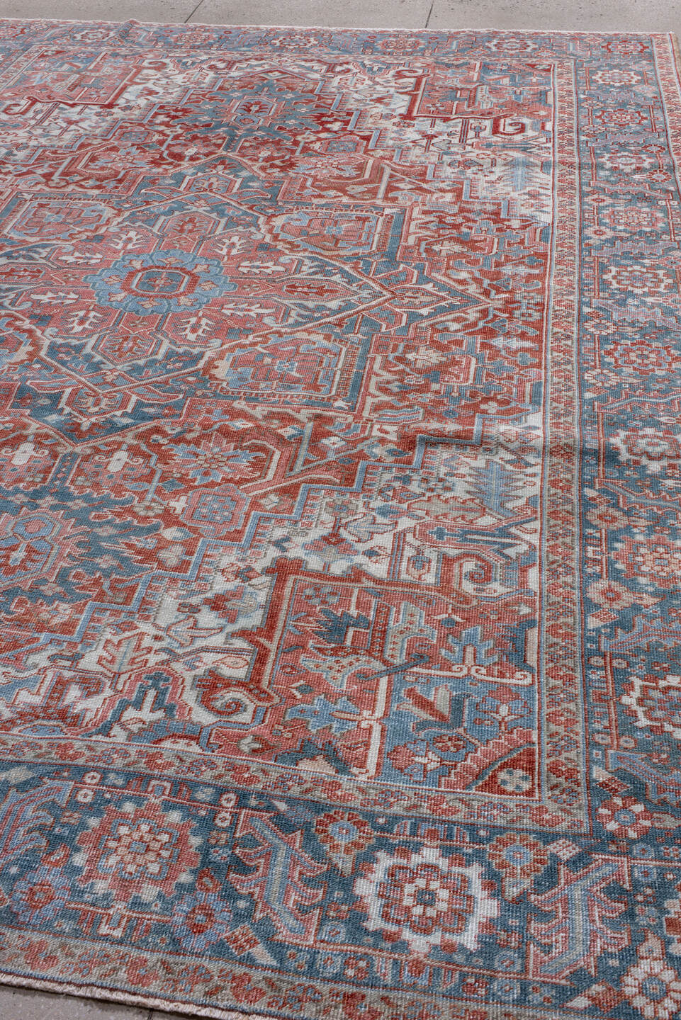 8' x 11' one-of-a-kind handmade antique Heriz large size rug. Color palette: ivory, sky blue, rust, terra cotta, brick