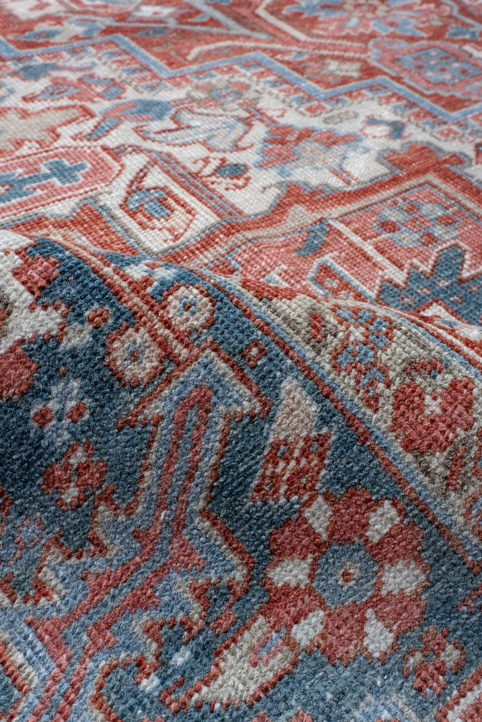 8' x 11' one-of-a-kind handmade antique Heriz large size rug. Color palette: ivory, sky blue, rust, terra cotta, brick