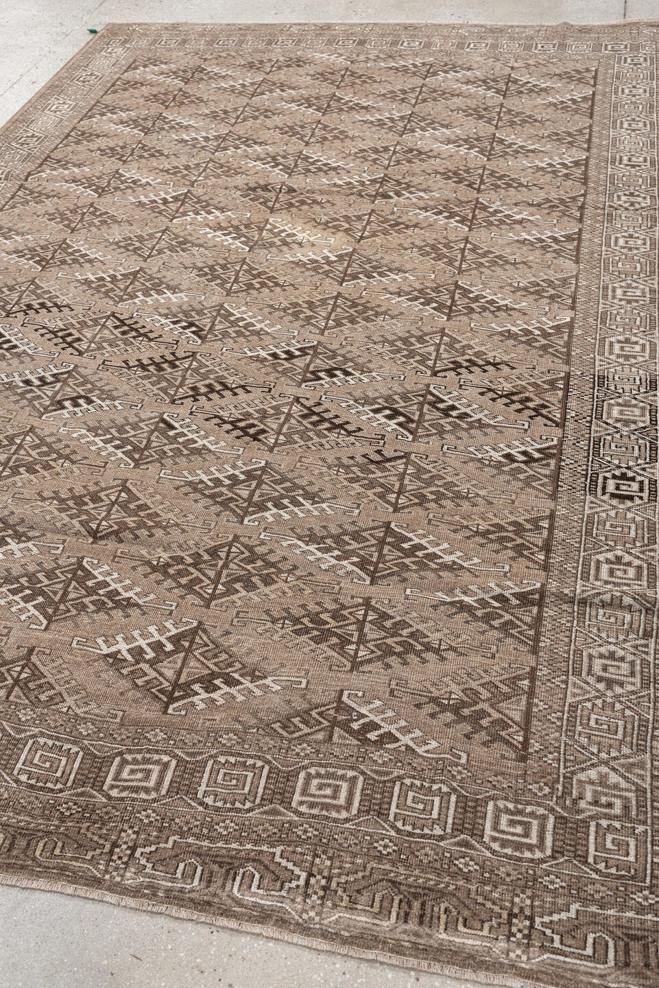 6' x 9' one-of-a-kind handmade antique Yamoud large size rug. Color palette: taupe, camel, ivory, brown, sand, charcoal