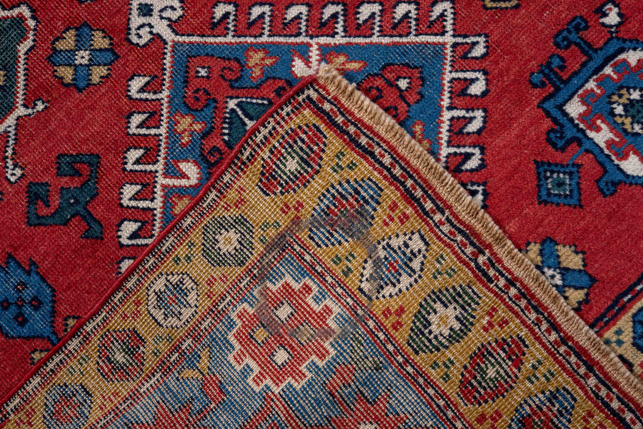 3' x 5' one-of-a-kind handmade vintage Caucasian small size rug. Color palette: red, blue, ivory, navy, teal, gold, crimson
