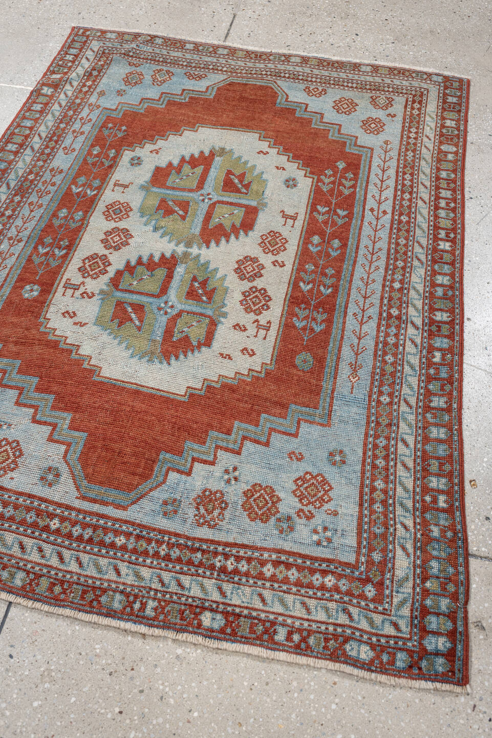 4' x 3' one-of-a-kind handmade antique Caucasian rug. Color palette: terracotta, sky blue, ivory, sage, rust, brown